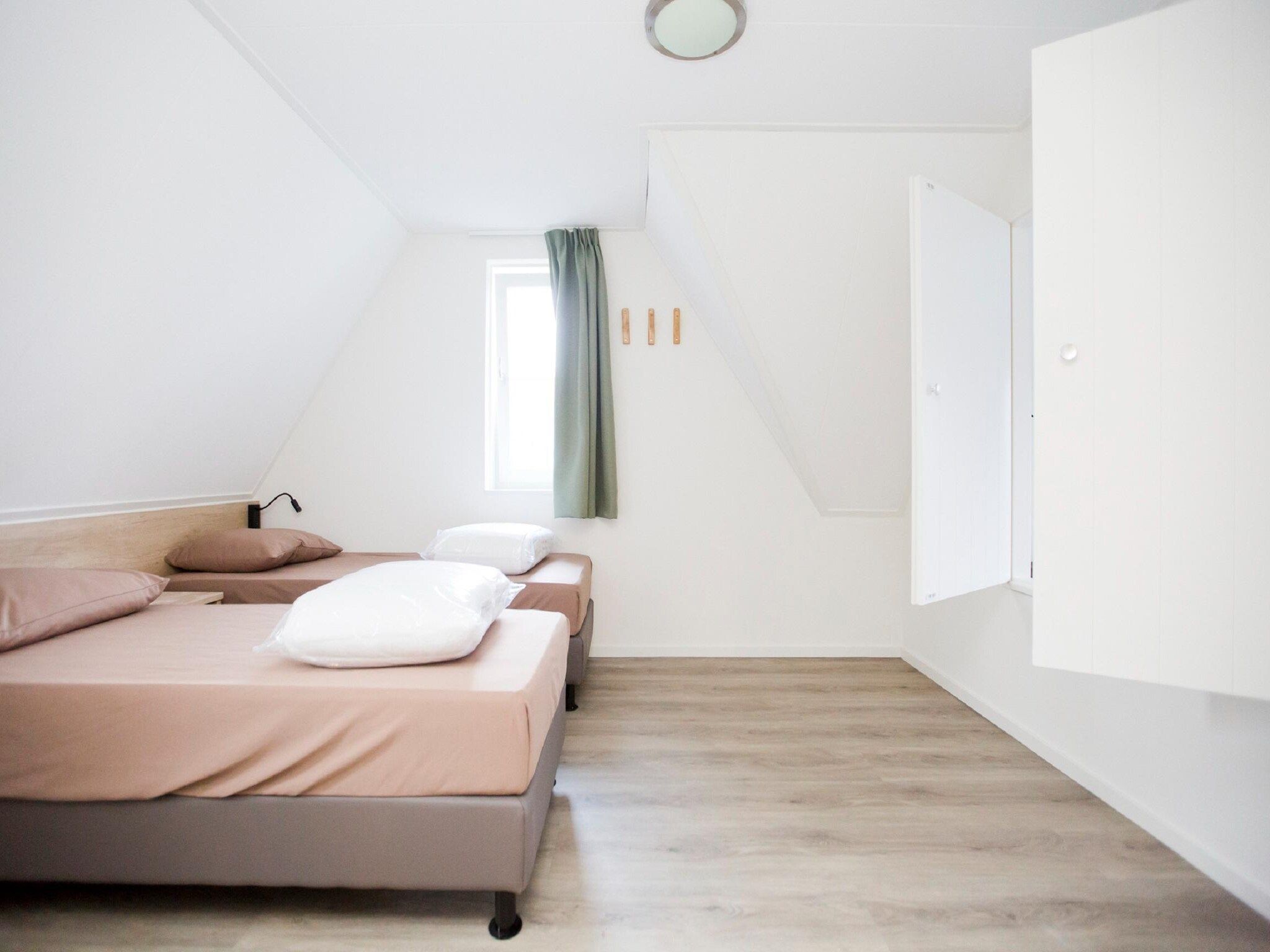 Een slaapkamer van Landgoed De IJsvogel 9 in Voorthuizen