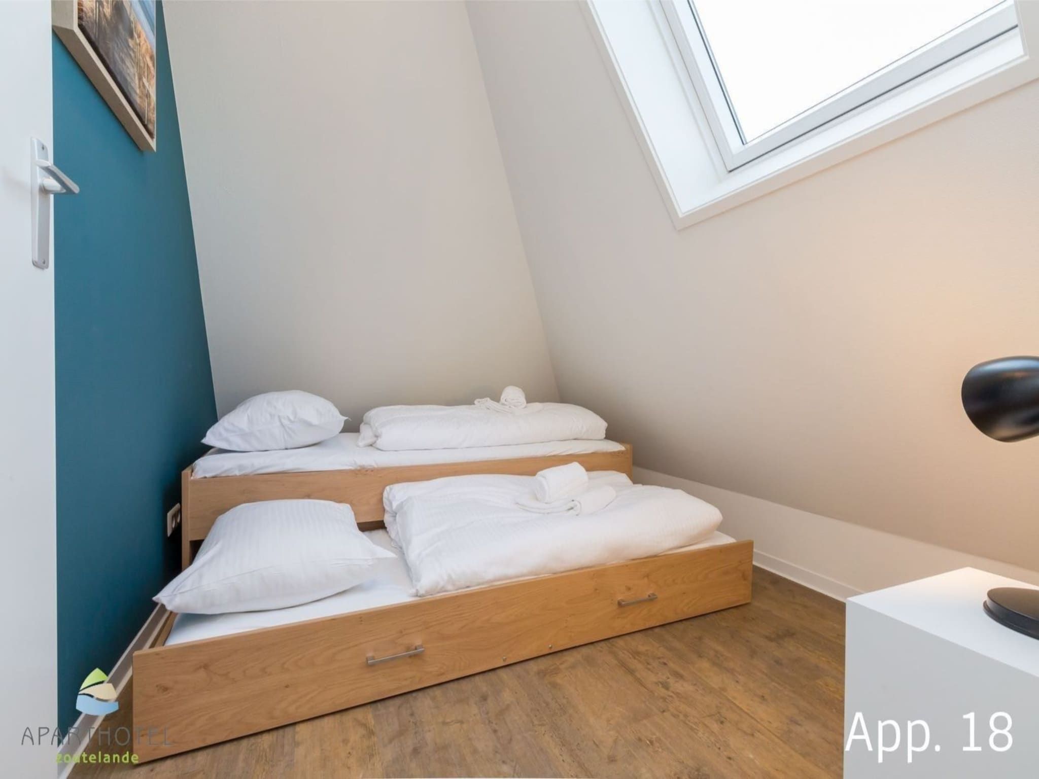 Een slaapkamer van Aparthotel Zoutelande - 6 pers luxe appartement huisdier in Zoutelande