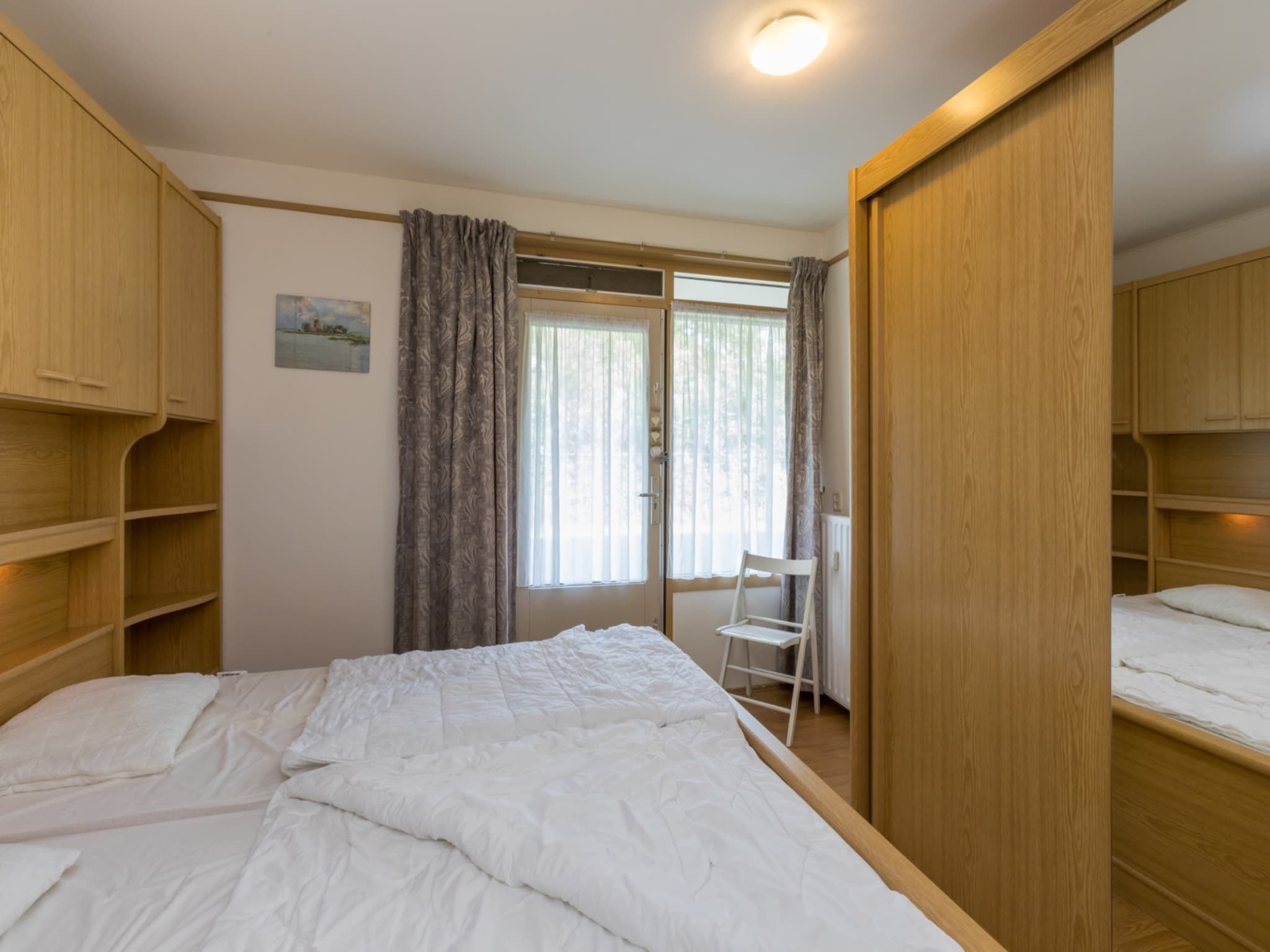 Een slaapkamer van Appartement - Burg van Woelderenlaan 100-2 in Walcheren
