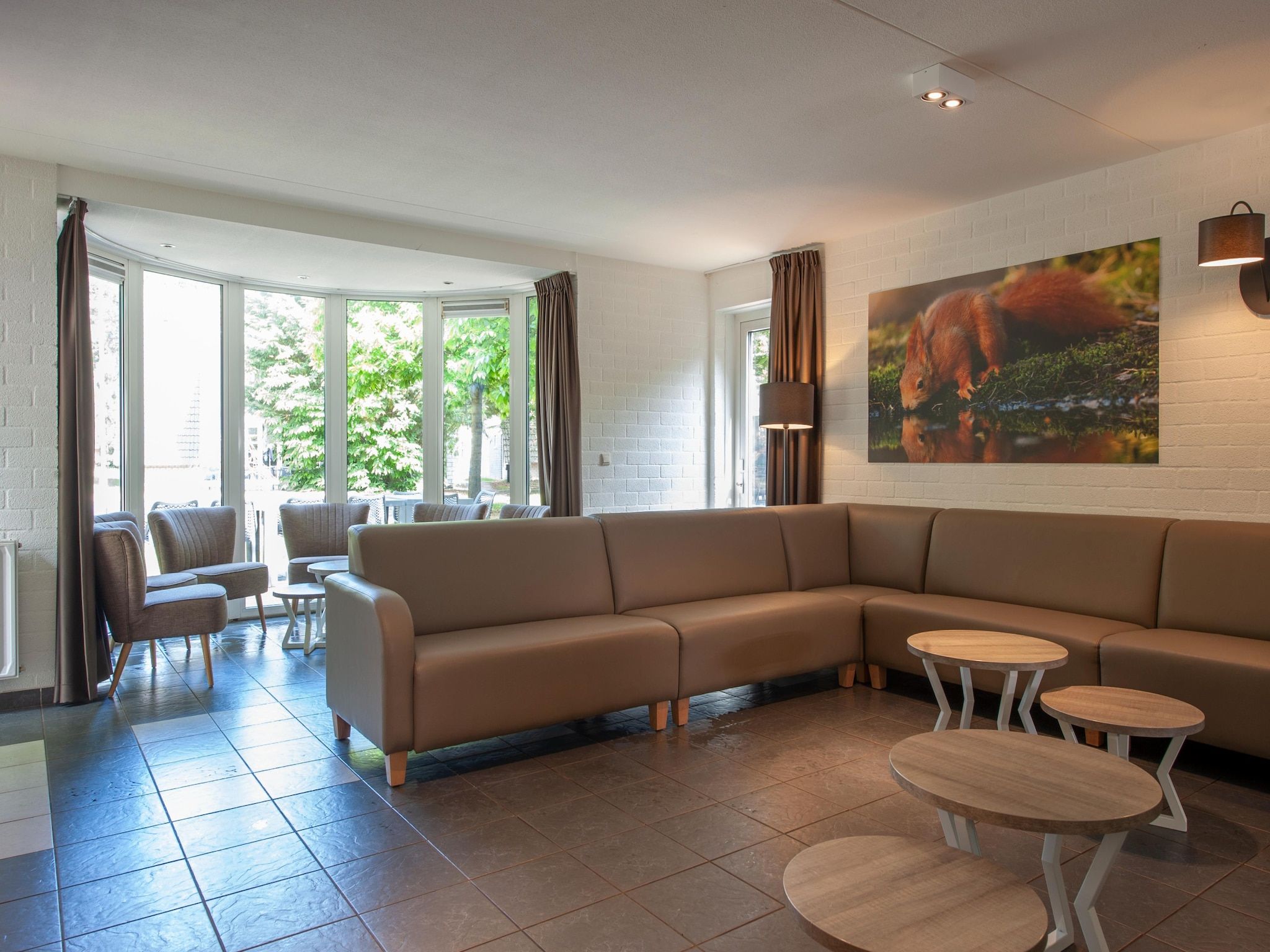 De woonkamer van Vakantiepark de Katjeskelder 13 in Oosterhout