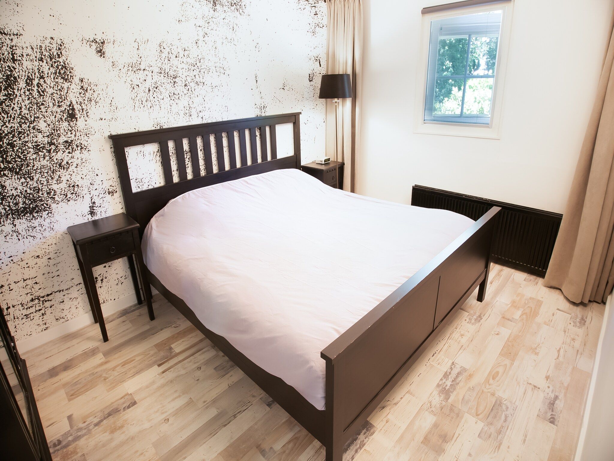 Een slaapkamer van Botterlodge in Wateren