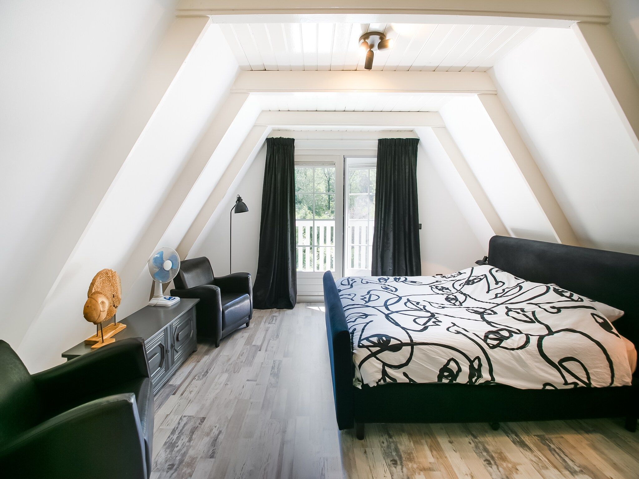 Een slaapkamer van Botterlodge in Wateren