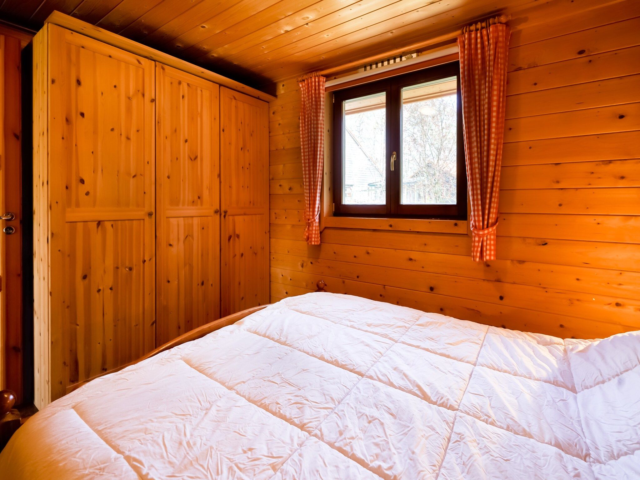 Een slaapkamer van Finse Bungalow in Holten in Holten