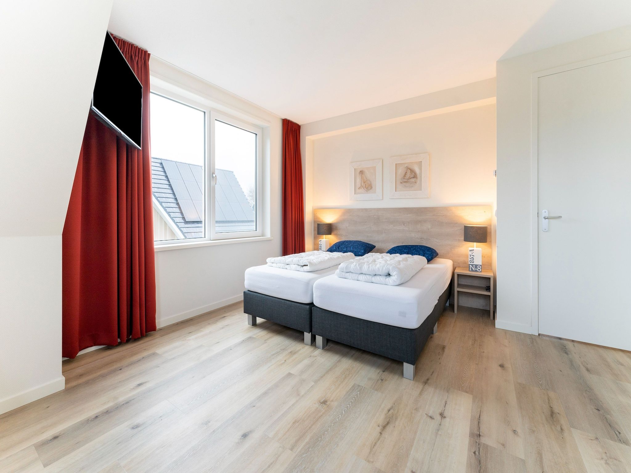 Een slaapkamer van So What 21 in De Koog Texel