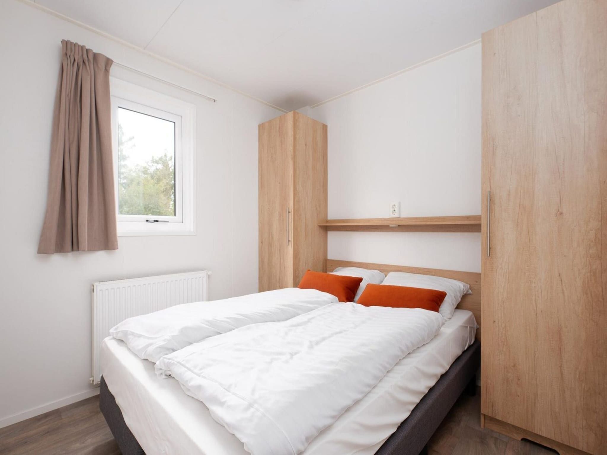 Een slaapkamer van Vakantiepark Mölke 23 in Zuna