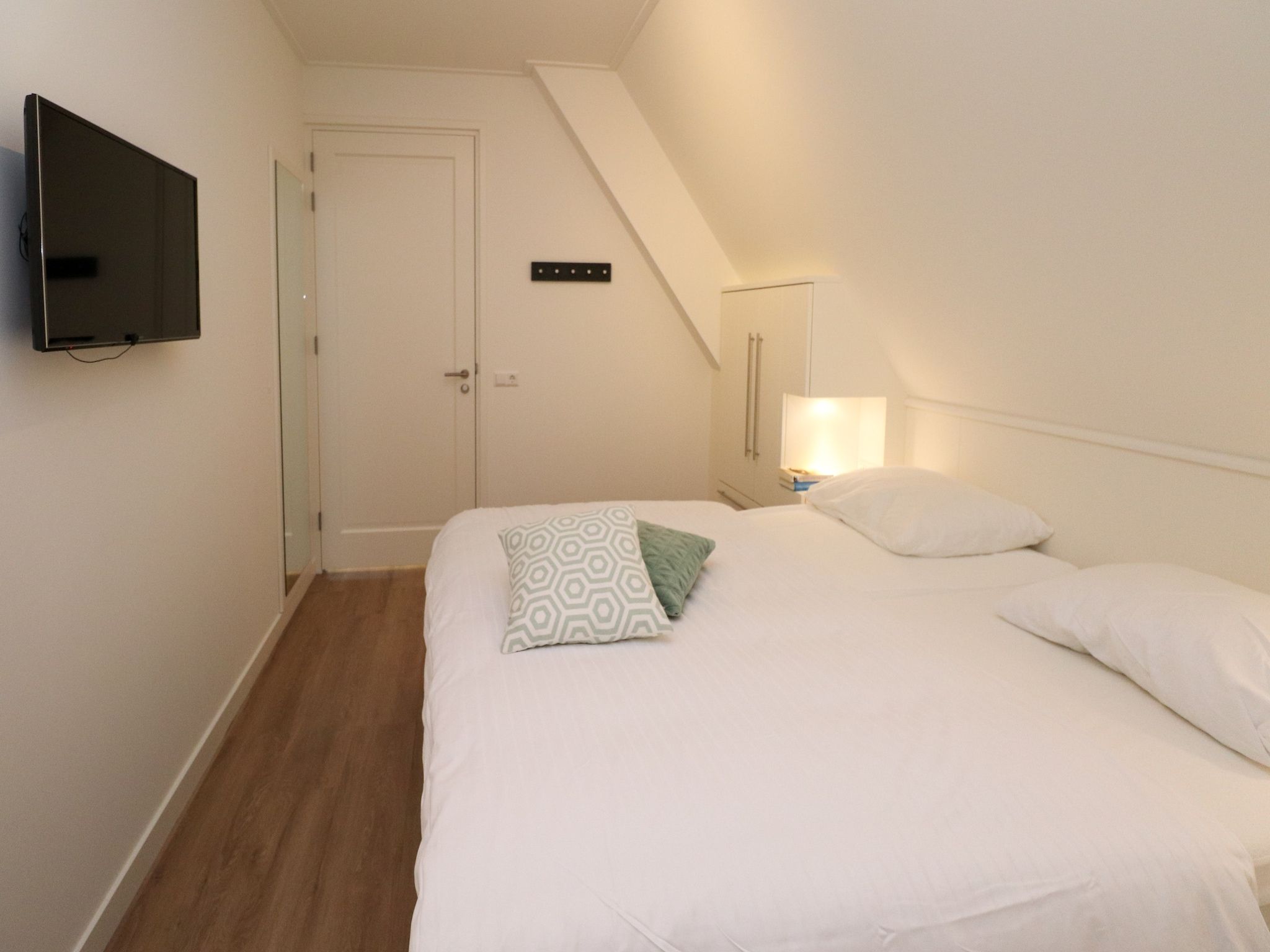 Een slaapkamer van Friese Meren Villa's 13 in Delfstrahuizen
