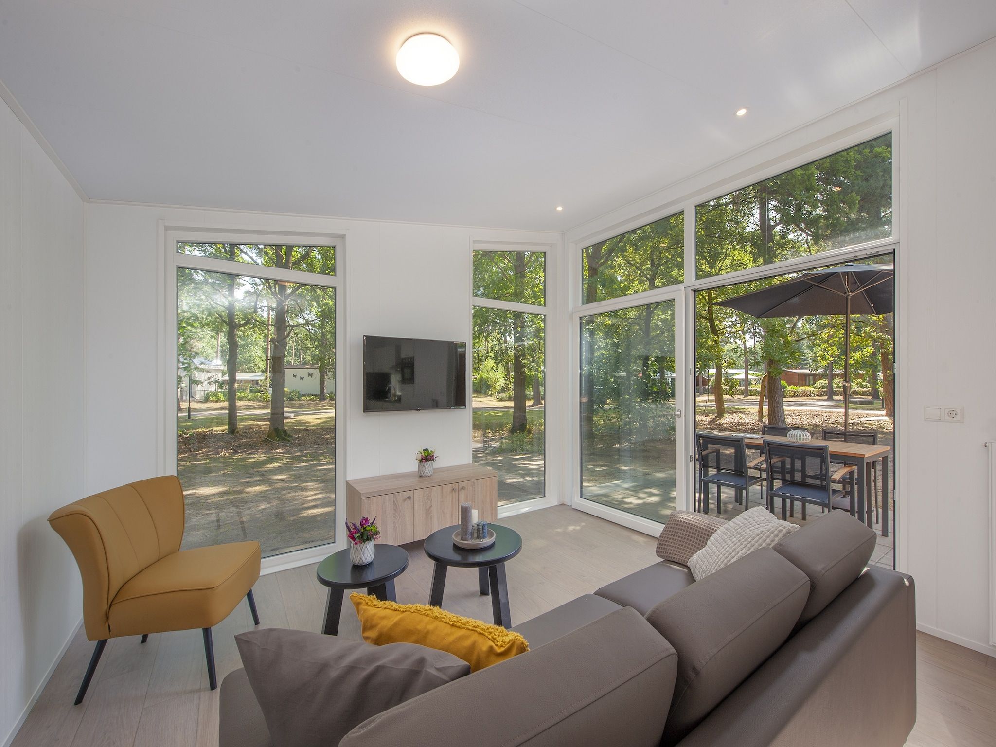 De woonkamer van Bospark 't Wolfsven 9 in Mierlo