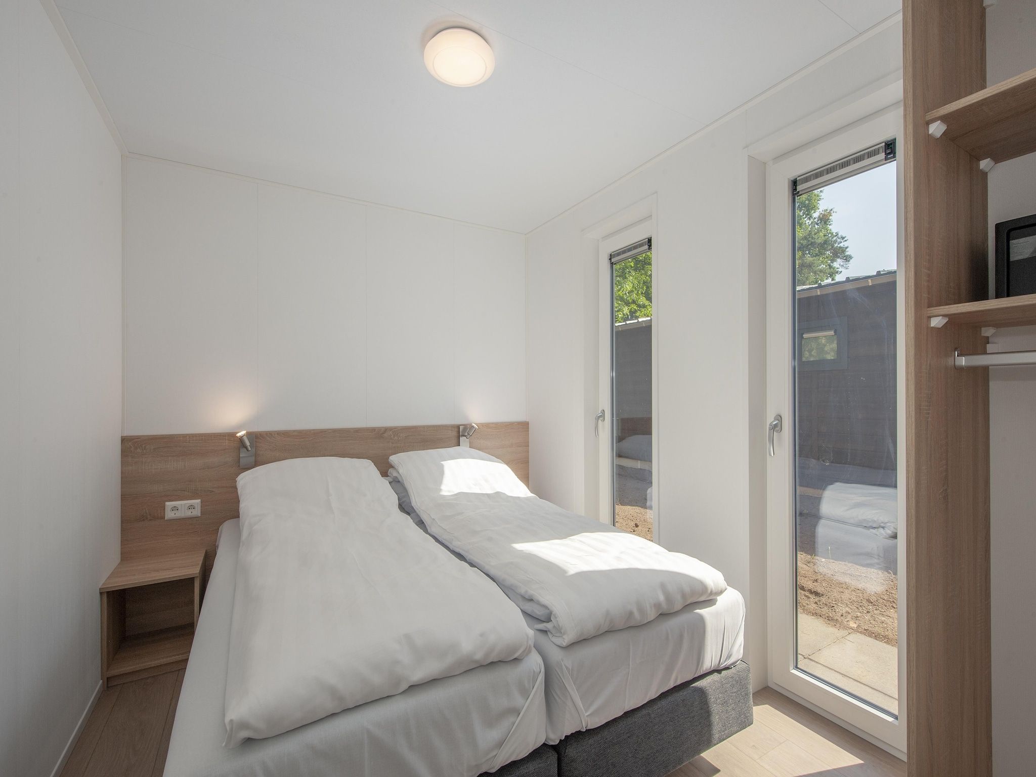 Een slaapkamer van Bospark 't Wolfsven 9 in Mierlo