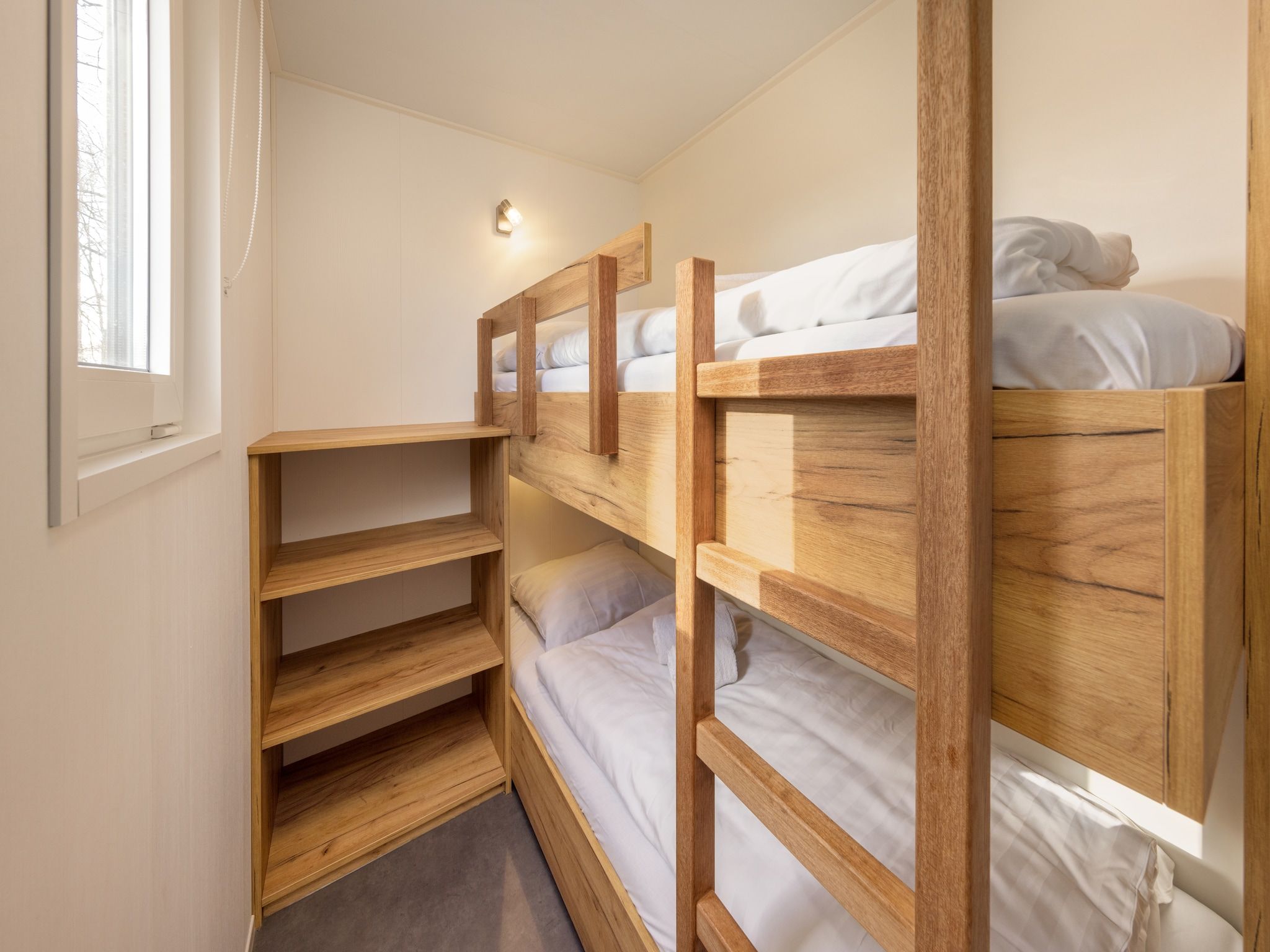 Een slaapkamer van Hunzepark 13 in Gasselternijveen