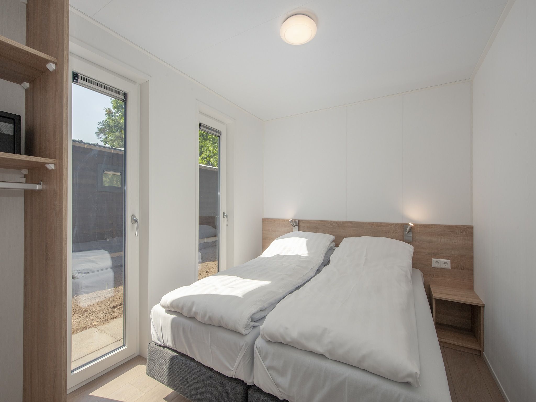 Een slaapkamer van Bospark 't Wolfsven 10 in Mierlo