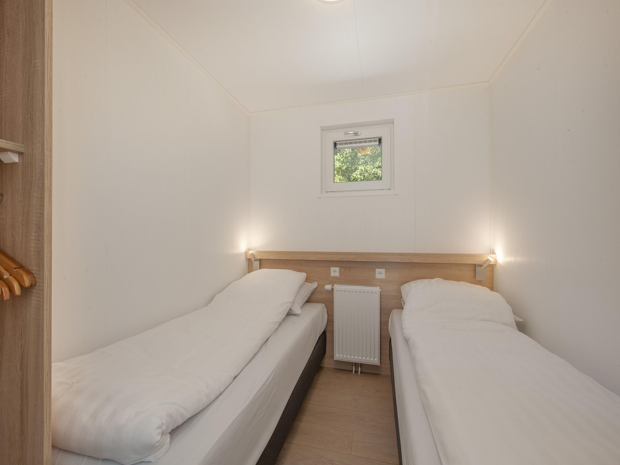 Een slaapkamer van Bospark 't Wolfsven 11 in Mierlo