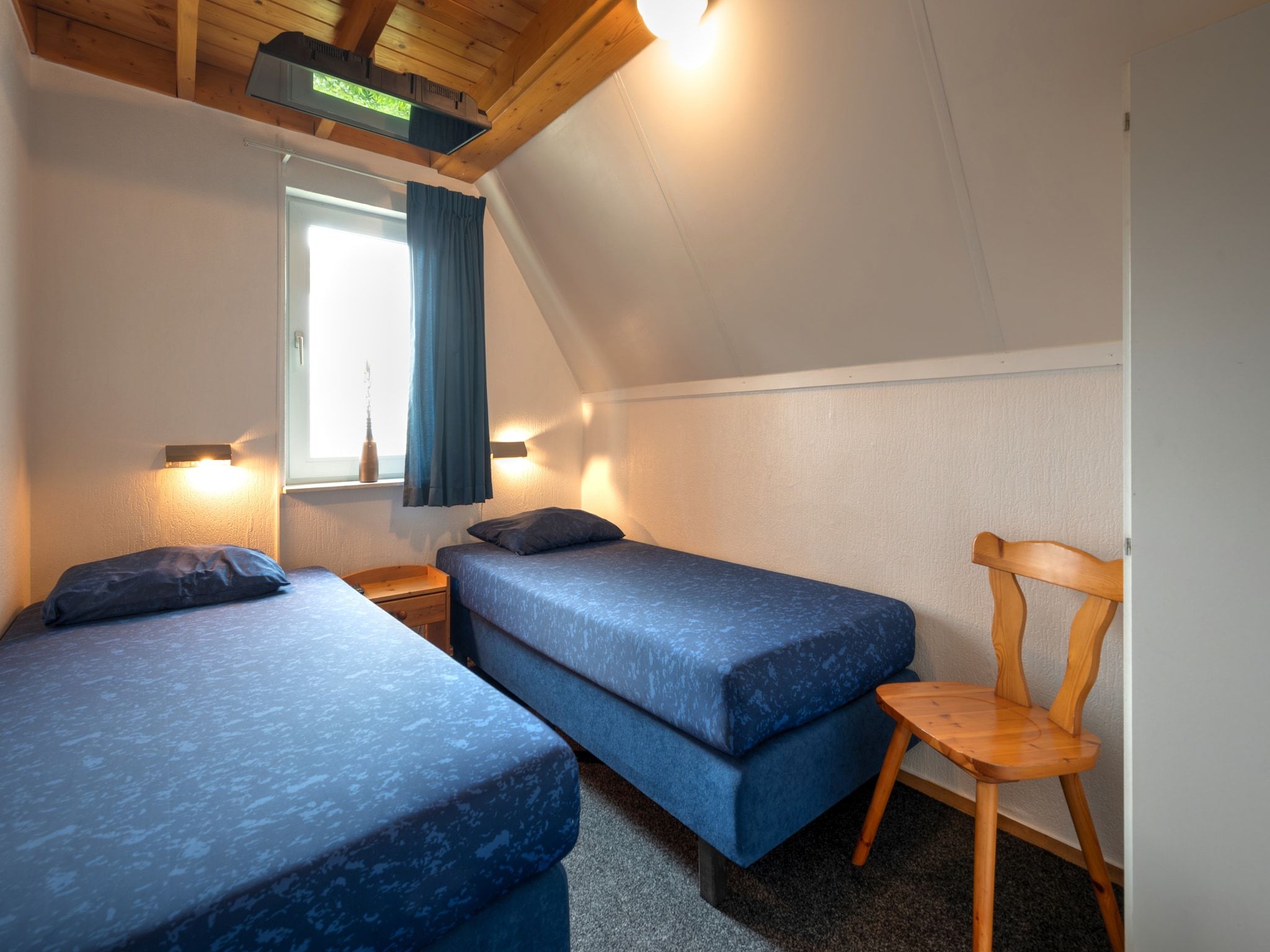 Een slaapkamer van Boslaan 1 in Gramsbergen