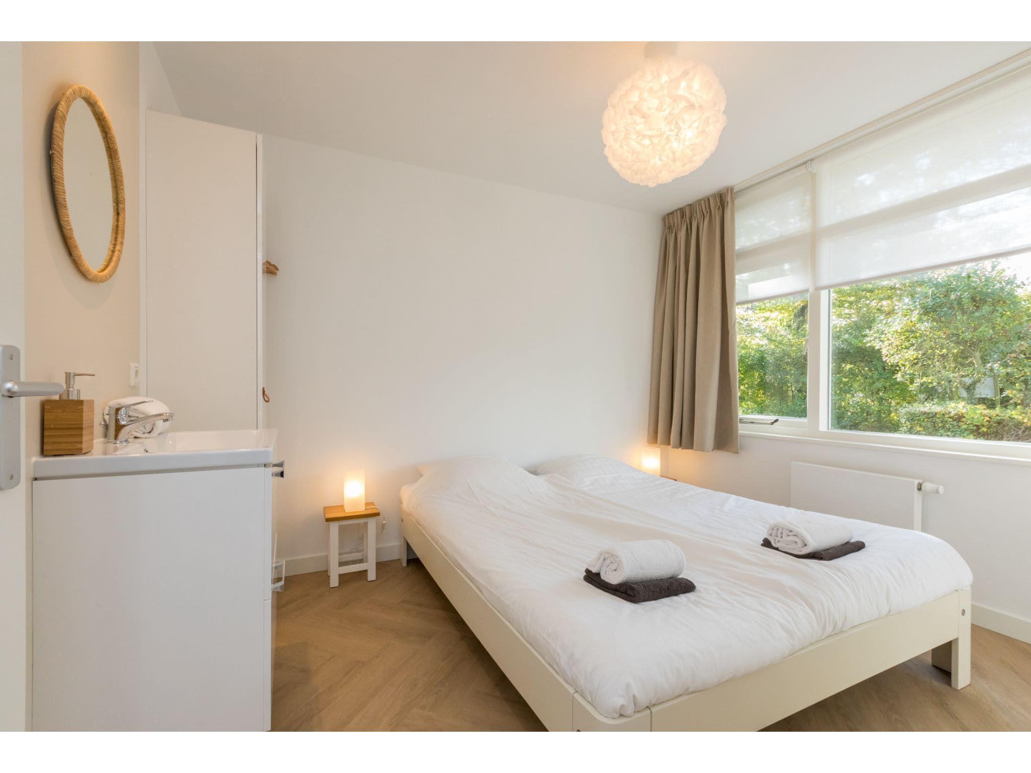 Een slaapkamer van Oosterpark 76 - Oostkapelle in Oostkapelle