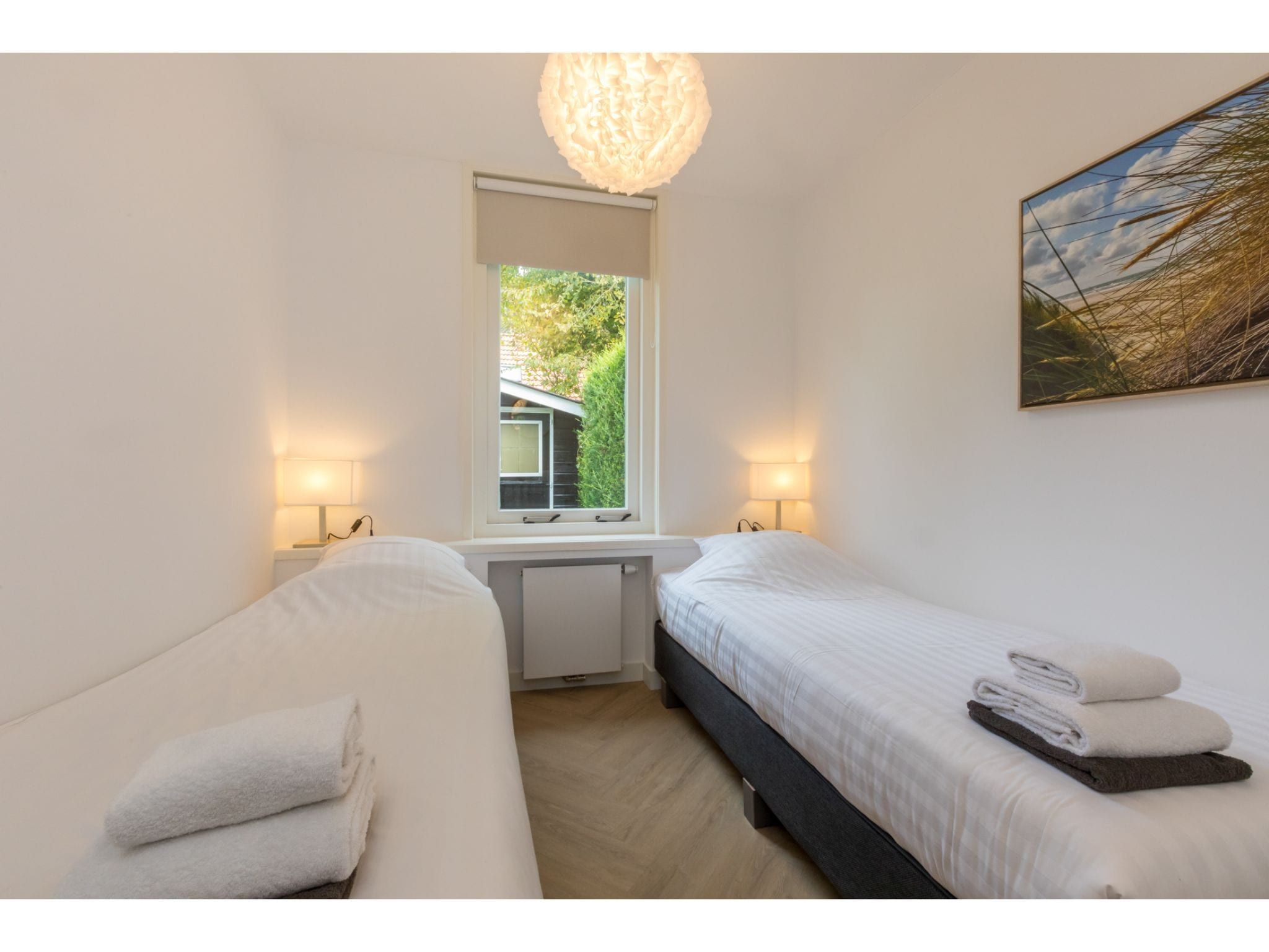 Een slaapkamer van Oosterpark 76 - Oostkapelle in Oostkapelle