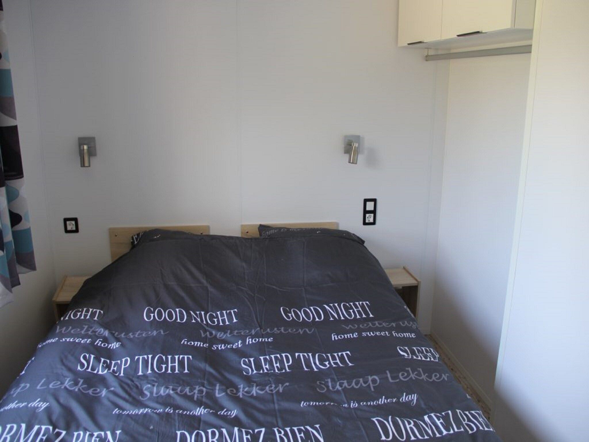 Een slaapkamer van Chalet Eke in De Veenhoop