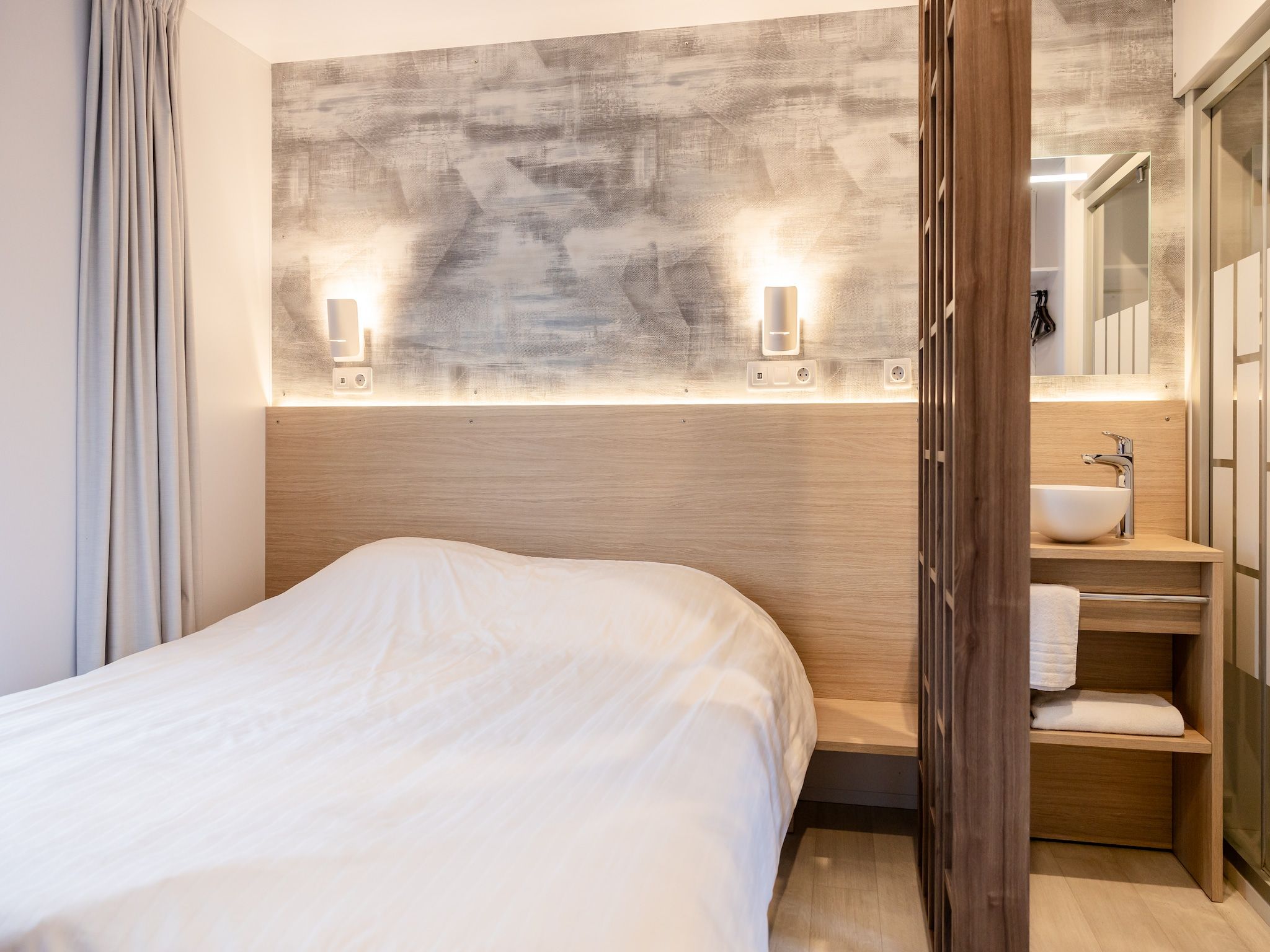 Een slaapkamer van Chalet Klaske in De Veenhoop