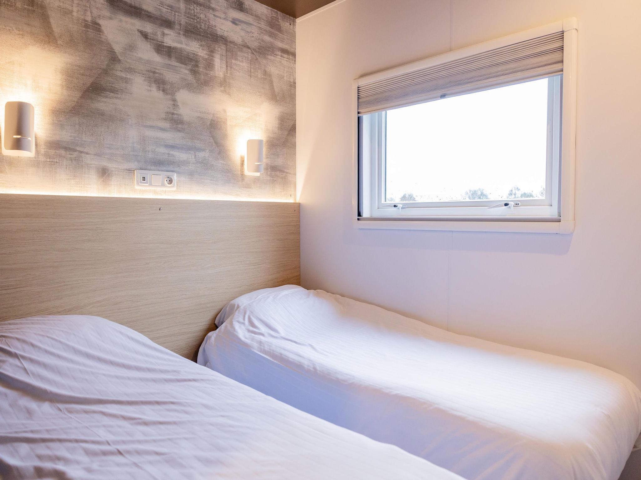 Een slaapkamer van Chalet Klaske in De Veenhoop