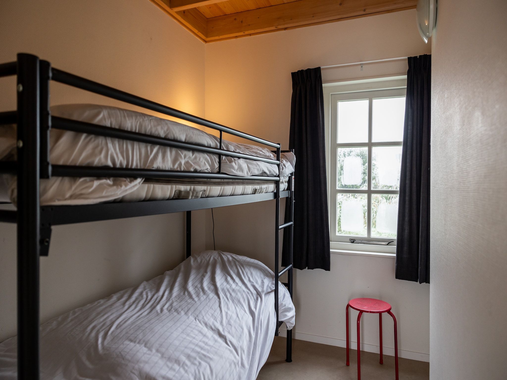 Een slaapkamer van Chalet Famke in De Veenhoop