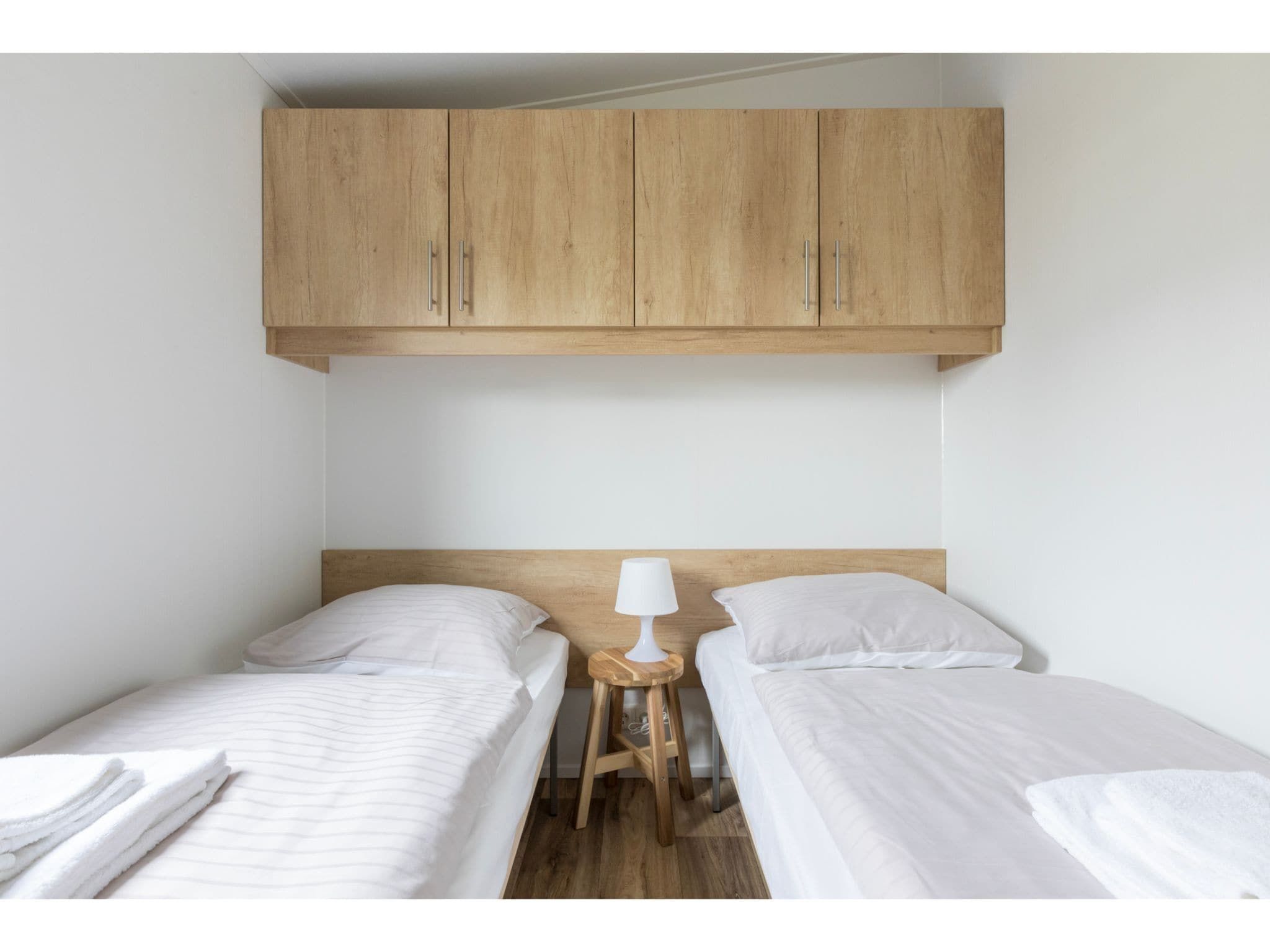 Een slaapkamer van Fort den Haak - Chalet 1 tm 15  hond in Vrouwenpolder