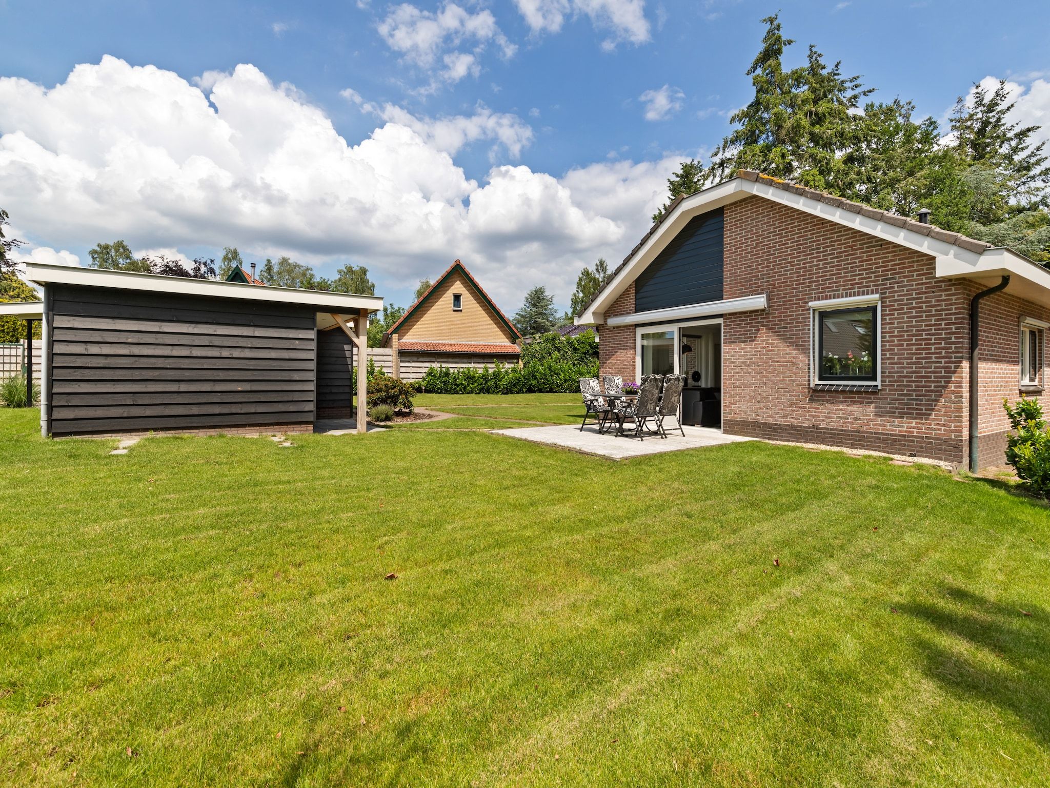 De tuin van Huisje Putten in Putten