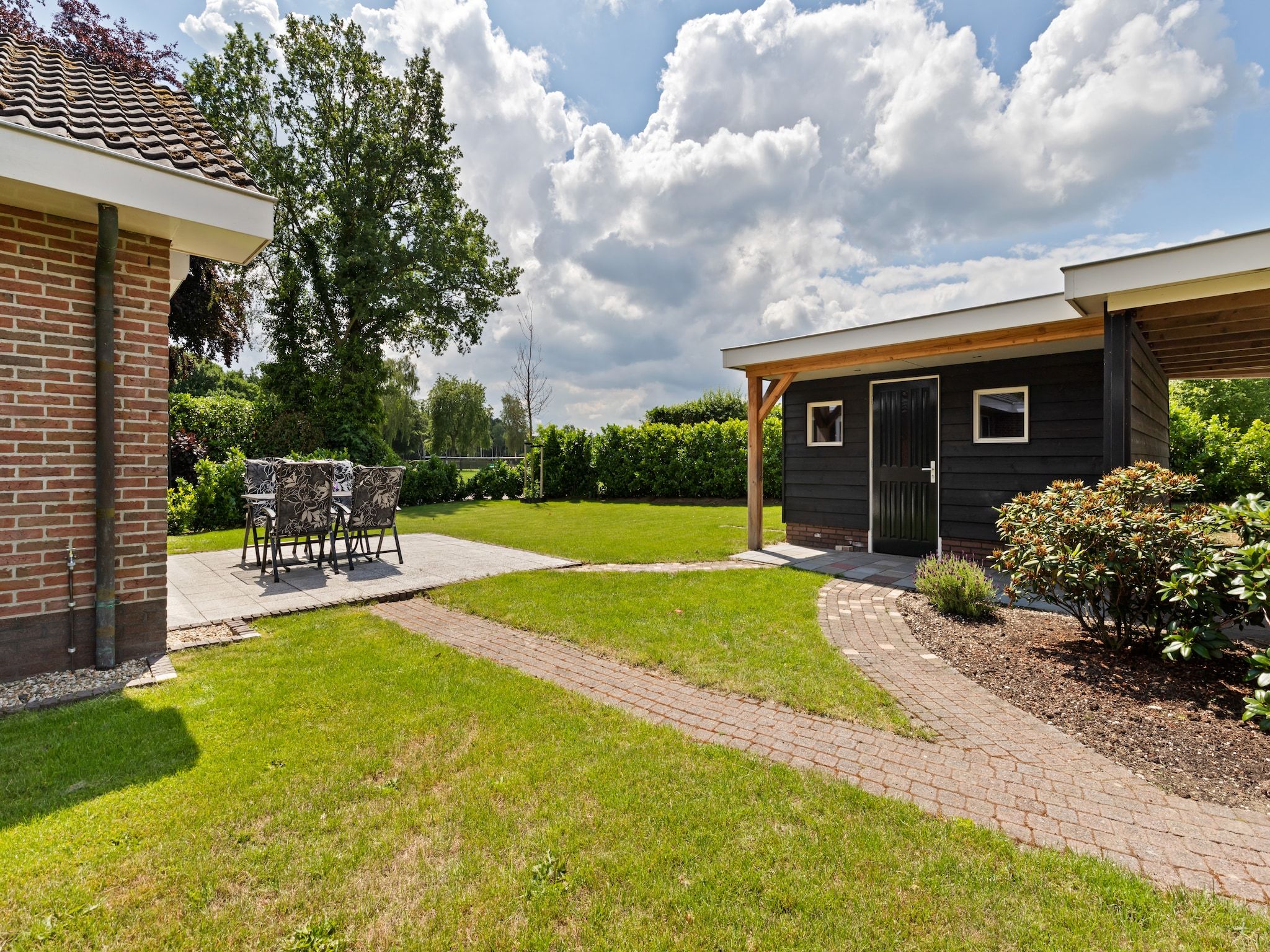 De tuin van Huisje Putten in Putten