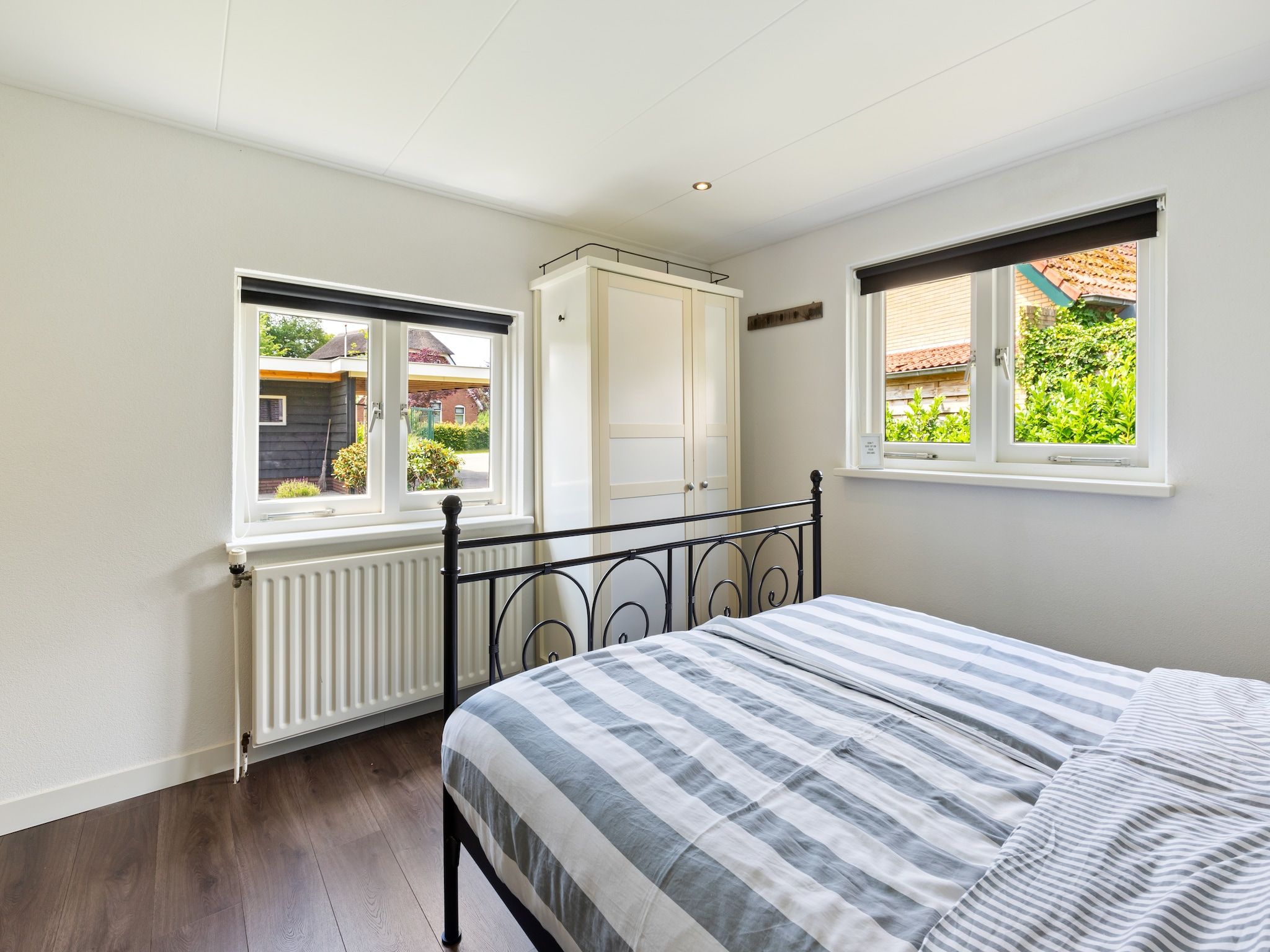 Een slaapkamer van Huisje Putten in Putten