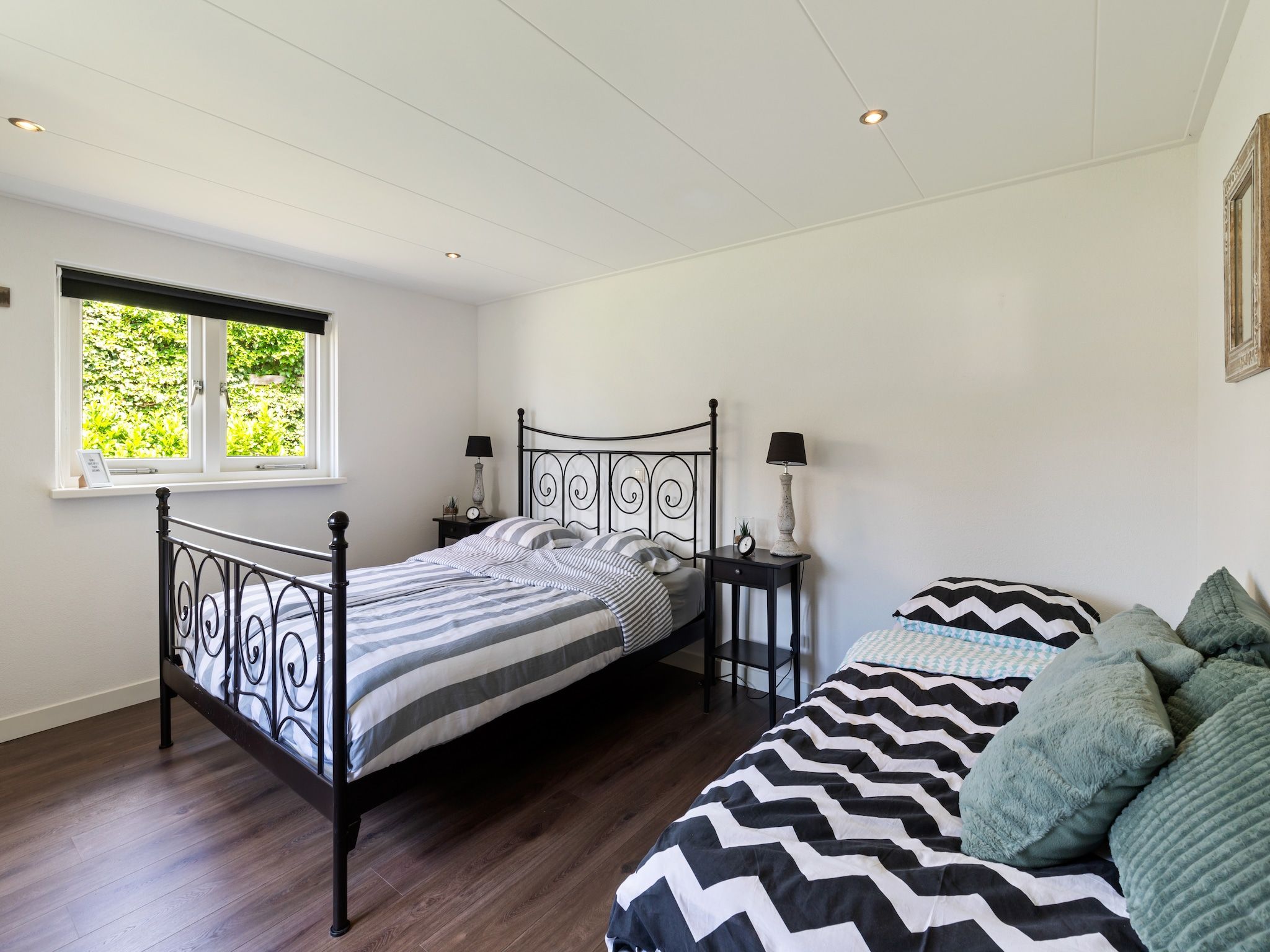 Een slaapkamer van Huisje Putten in Putten