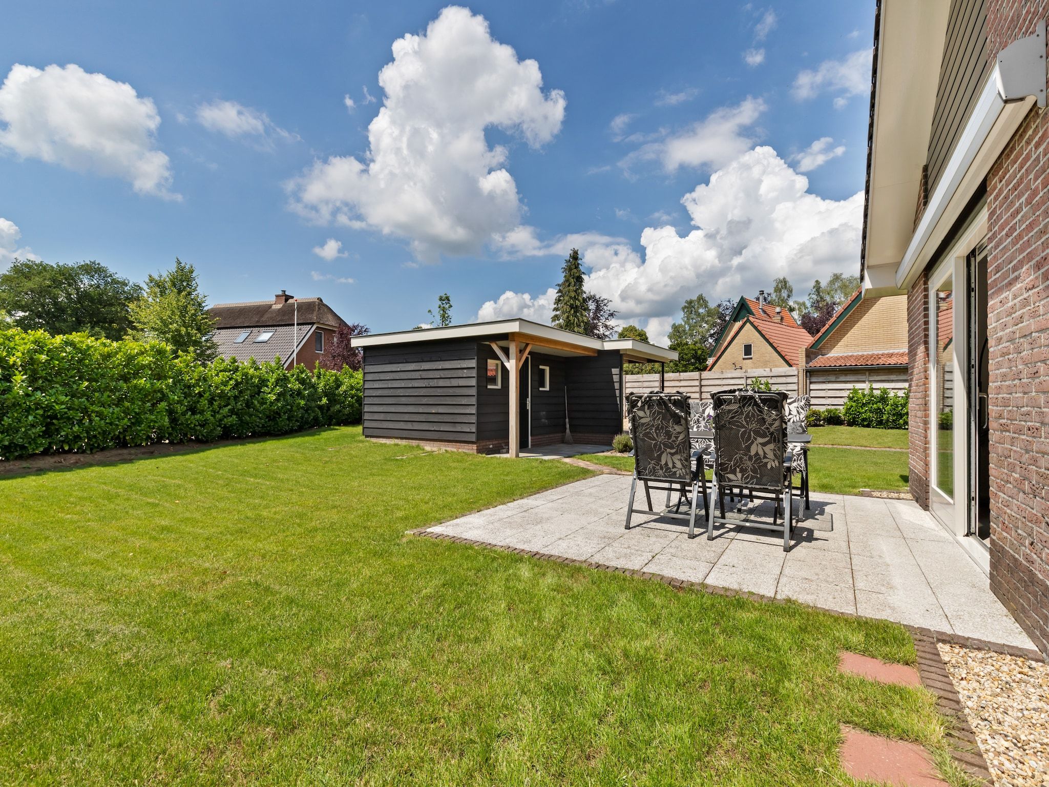 De tuin van Huisje Putten in Putten