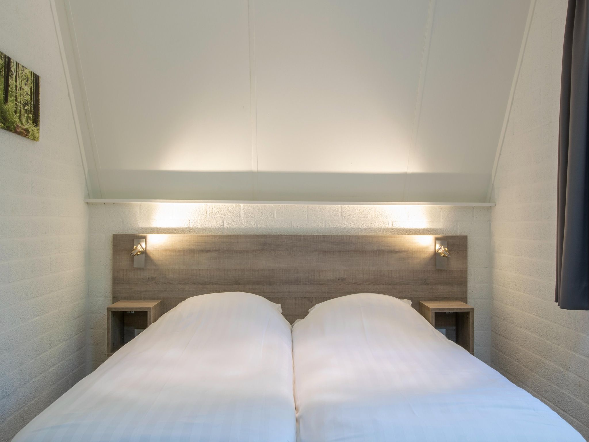 Een slaapkamer van Vakantiepark de Katjeskelder 14 in Oosterhout