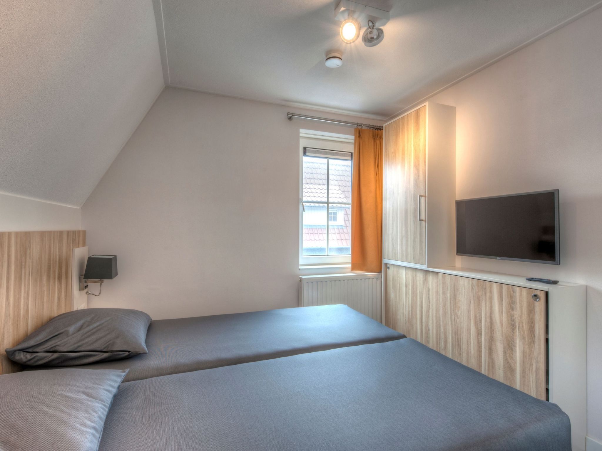 Een slaapkamer van Noordzee Résidence Dishoek 14 in Kamperland