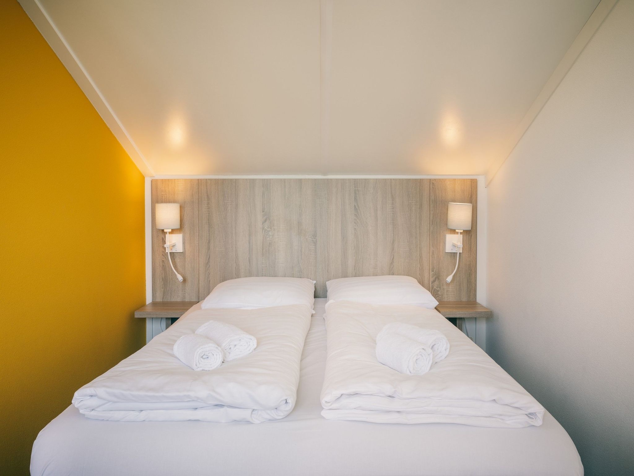 Een slaapkamer van Duinresort Dunimar 1 in Noordwijkerhout