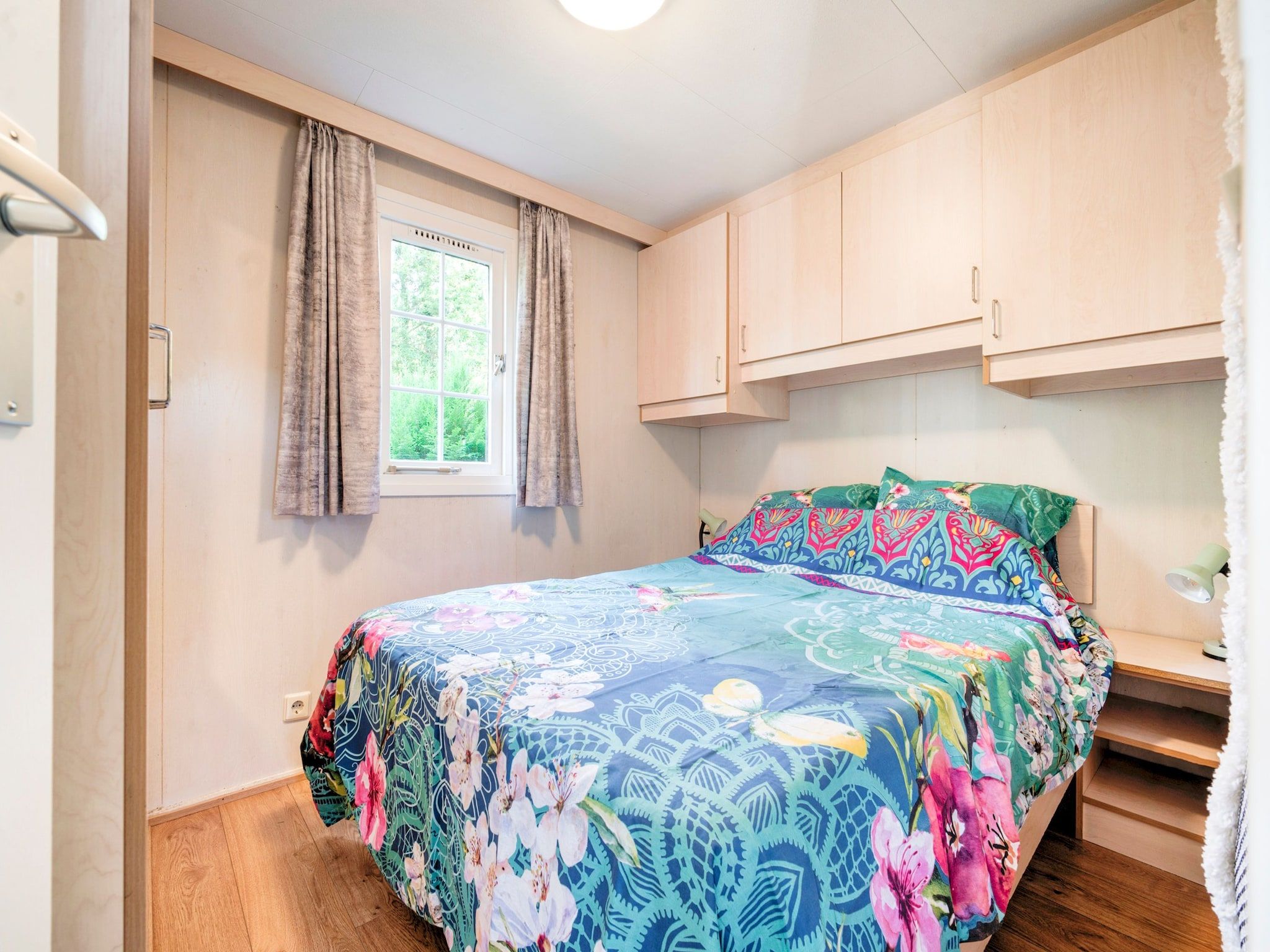 Een slaapkamer van Huisje 84 in Stegeren