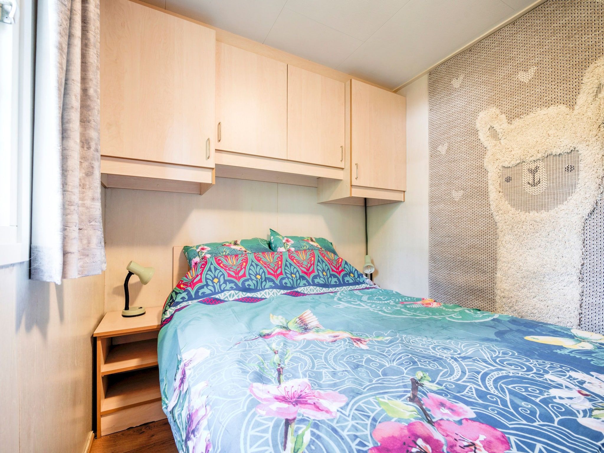 Een slaapkamer van Huisje 84 in Stegeren