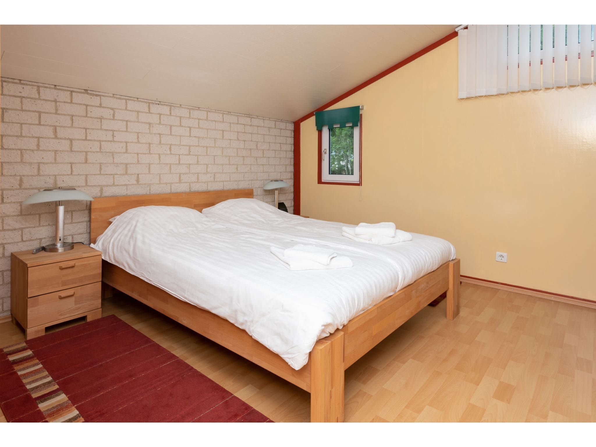 Een slaapkamer van Smallengange 45 in Kortgene