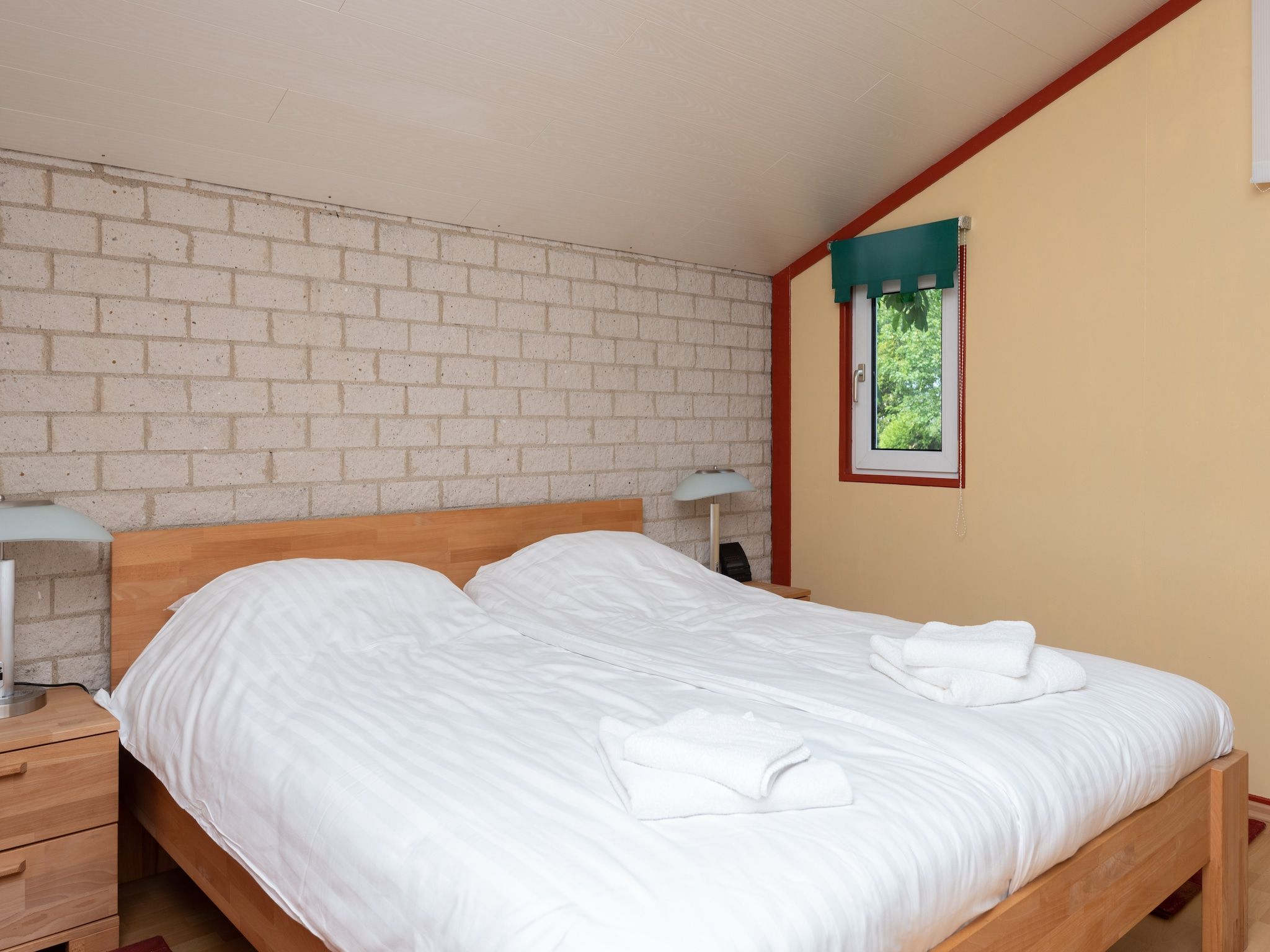 Een slaapkamer van Smallengange 45 in Kortgene