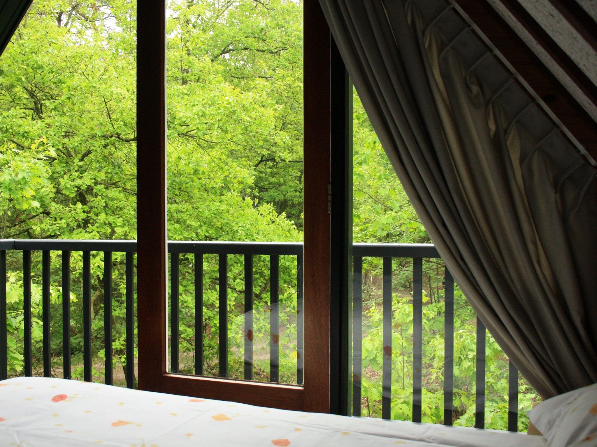 Een slaapkamer van Vakantiepark Herperduin 19 in Herpen