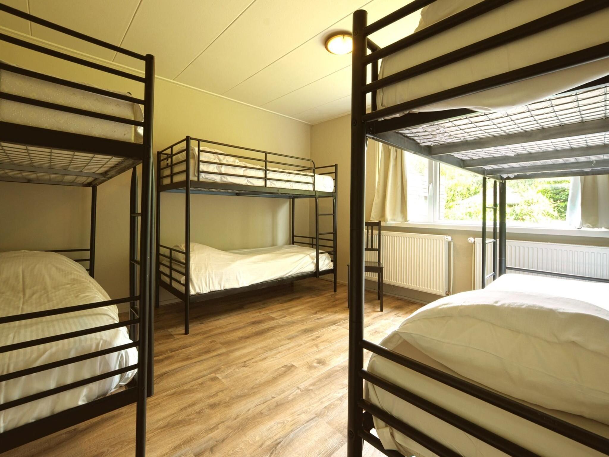 Een slaapkamer van Familiehuis Ruighenrode in Lochem