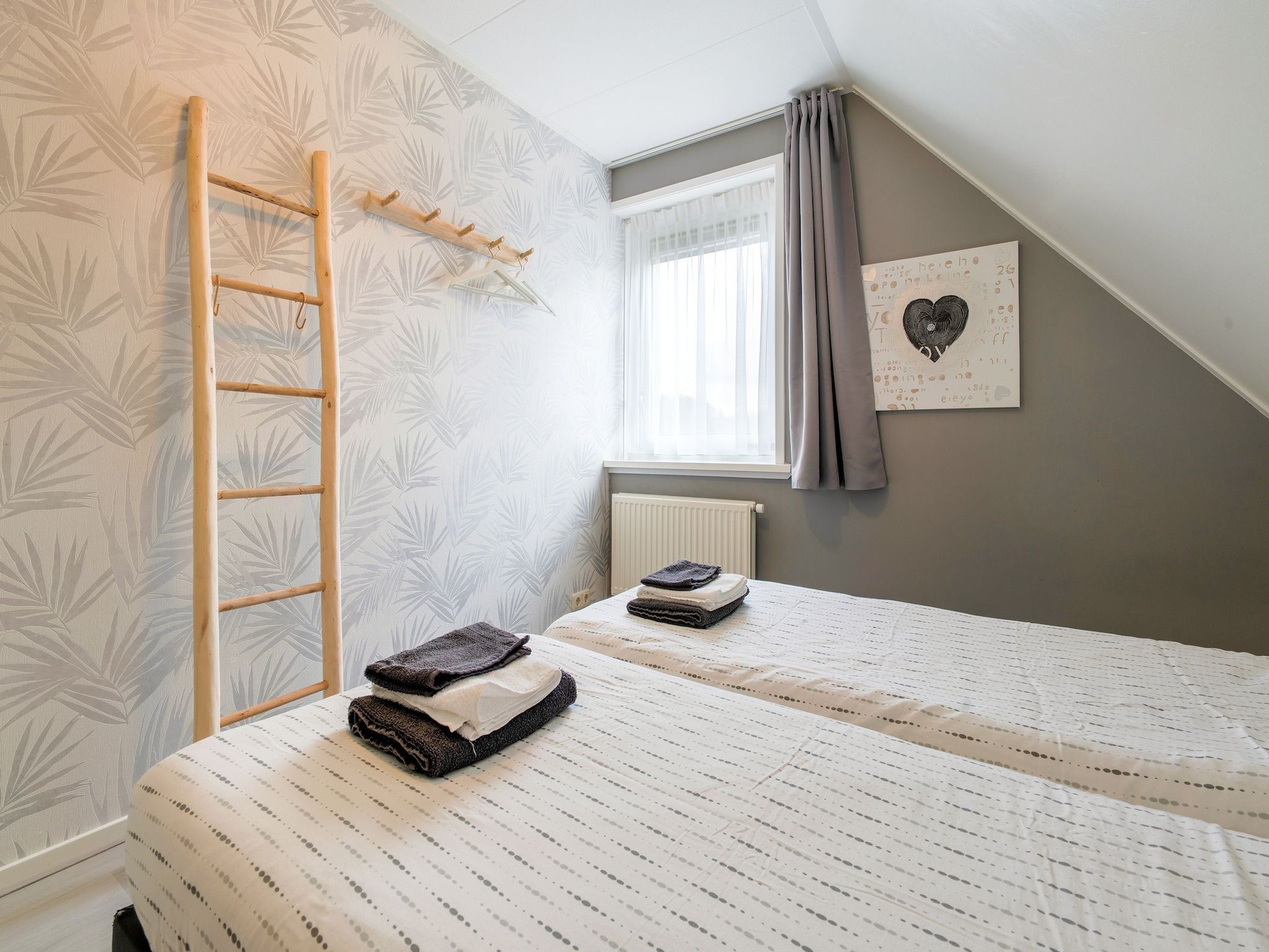 Een slaapkamer van Zonnig Hosterwold in Zeewolde