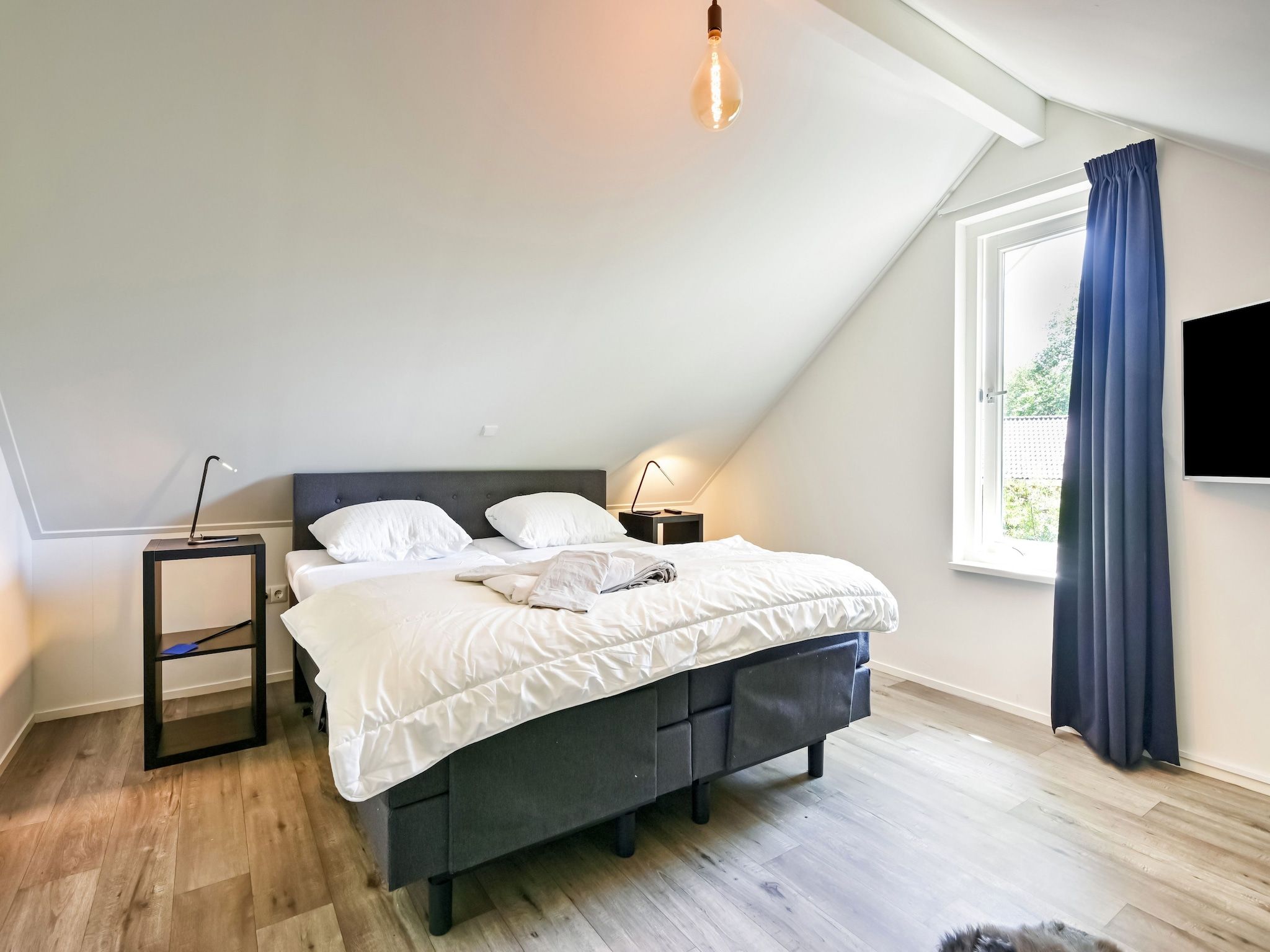 Een slaapkamer van Uitzicht in Reutum