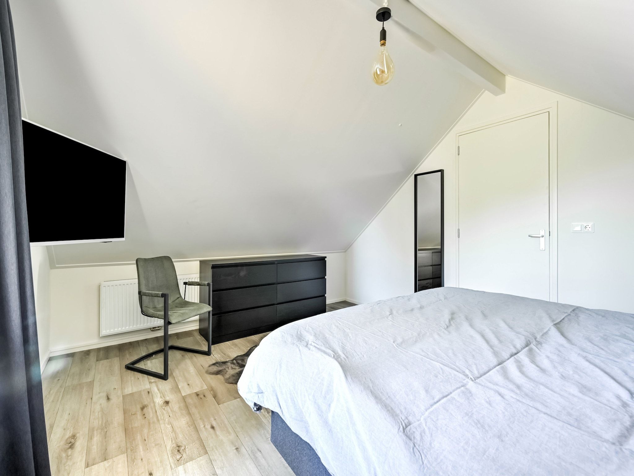 Een slaapkamer van Uitzicht in Reutum