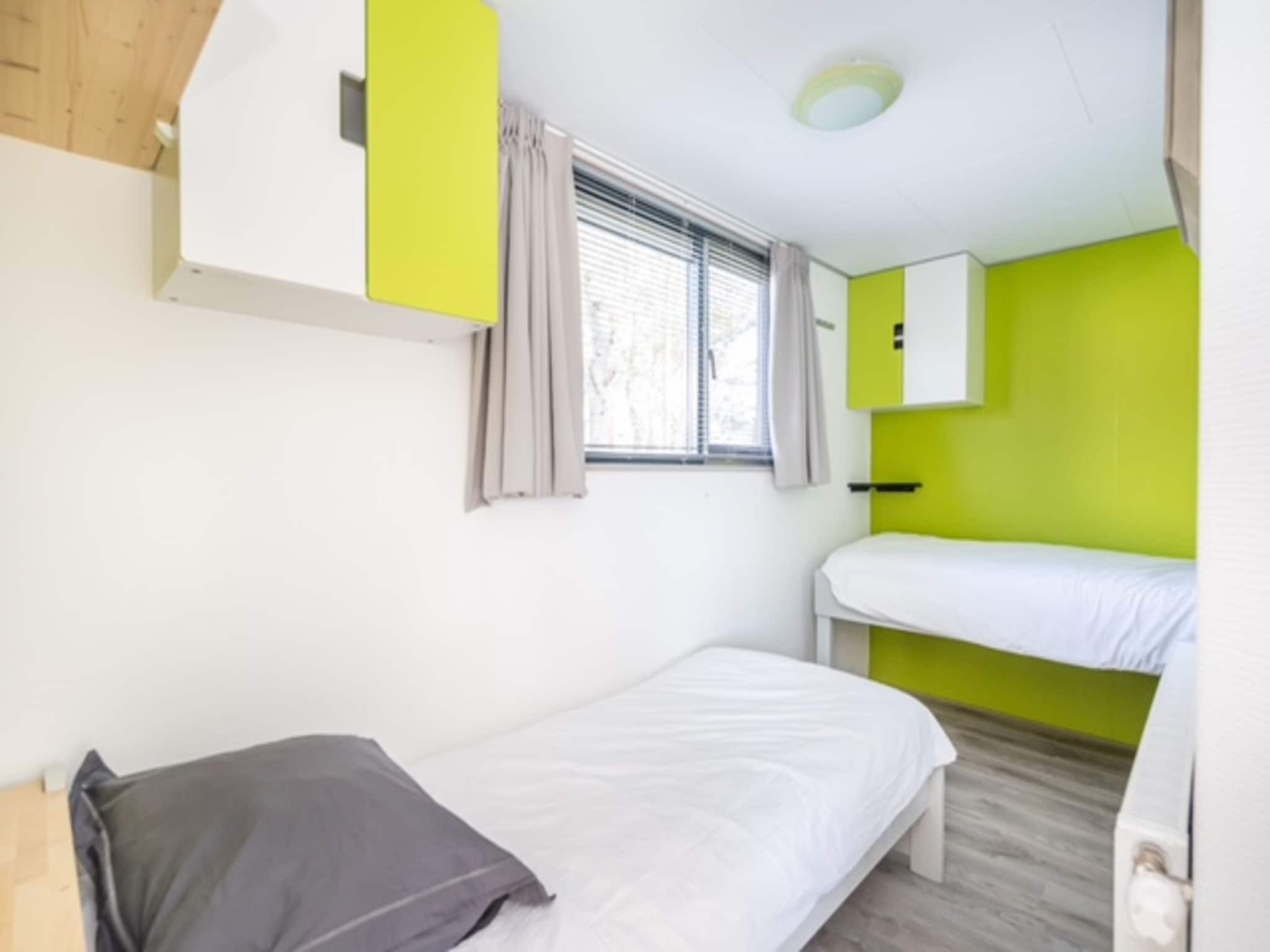 Een slaapkamer van Chalet Sea Rocks in Goedereede