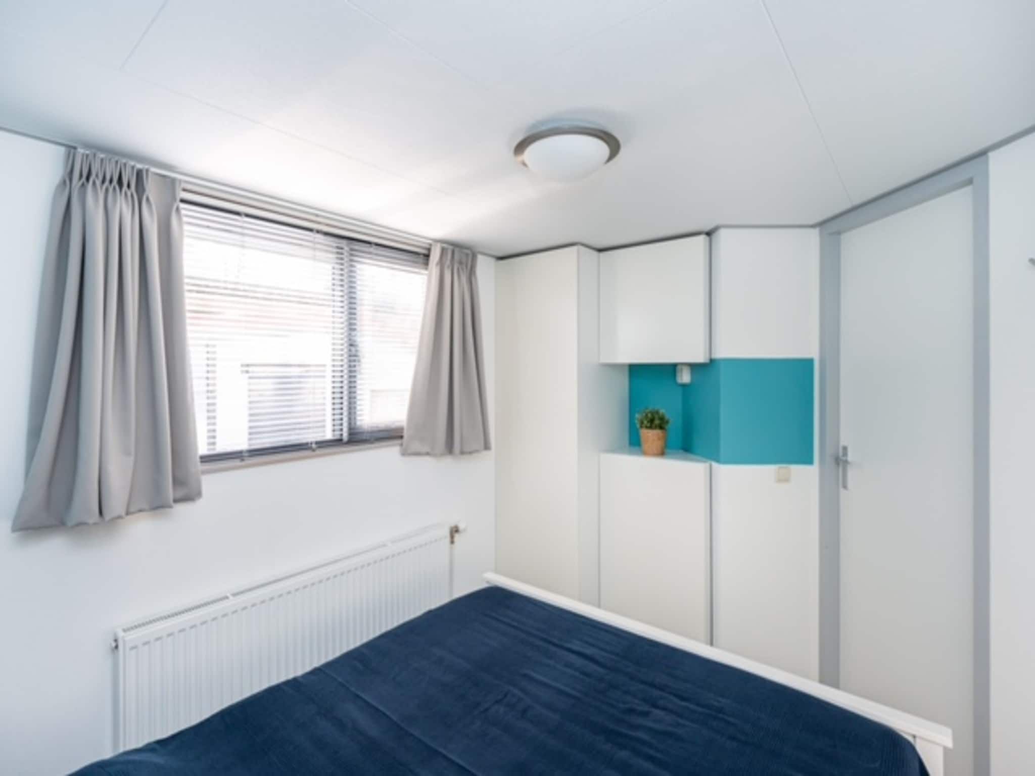 Een slaapkamer van Chalet Sea Rocks in Goedereede