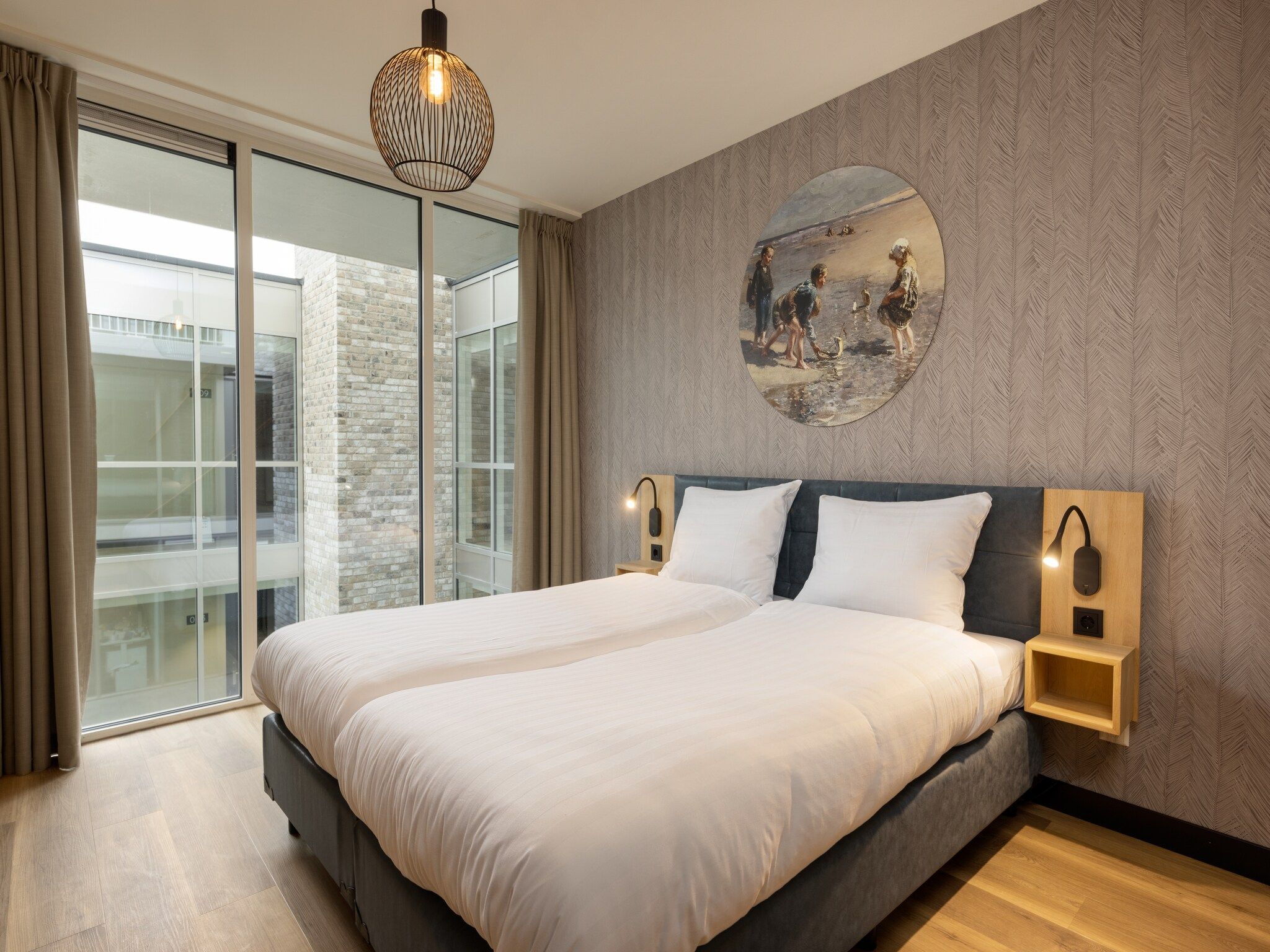 Een slaapkamer van Residentie de Graaf van Egmont 11 in Egmond aan zee