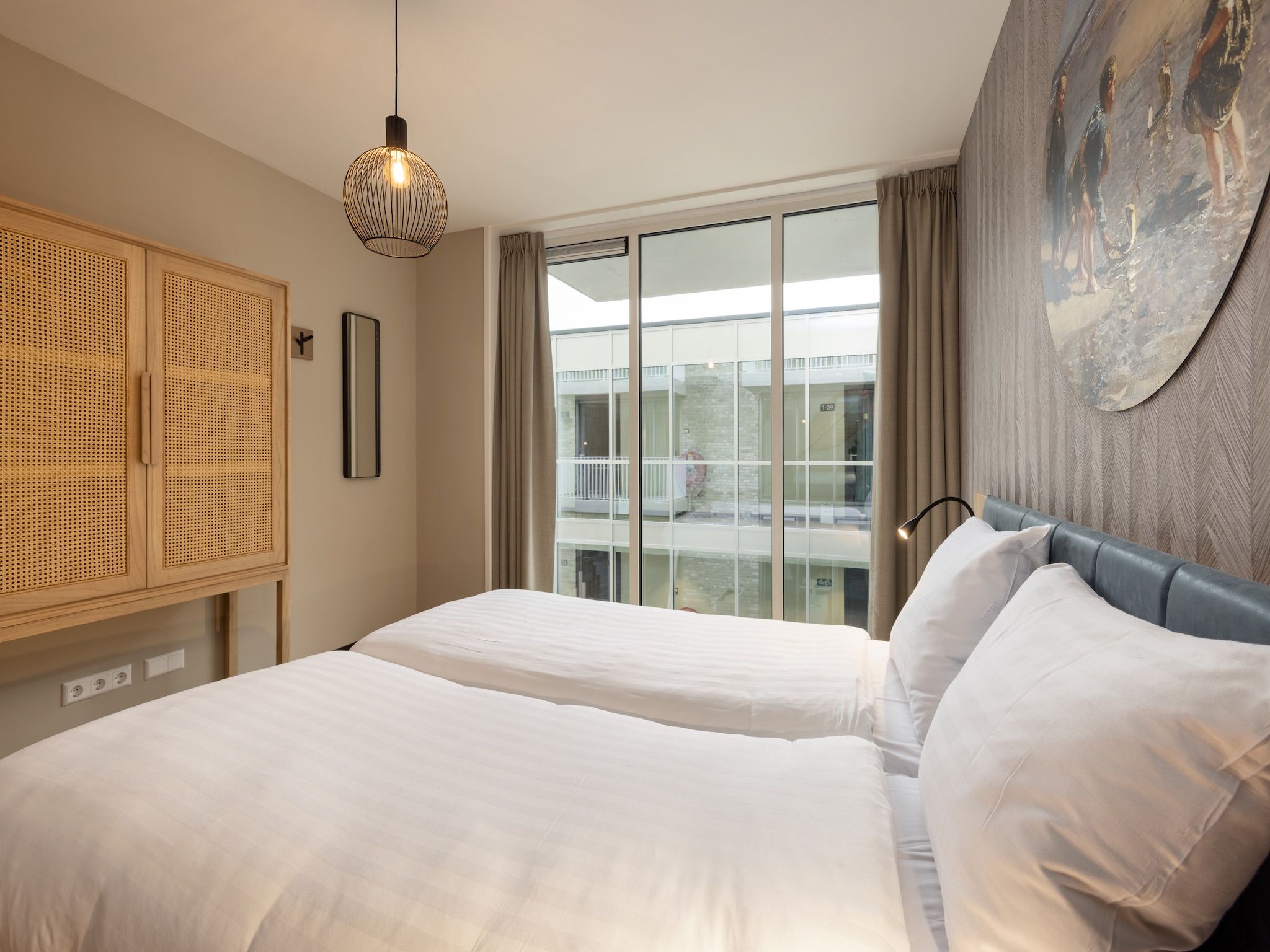 Een slaapkamer van Residentie de Graaf van Egmont 11 in Egmond aan zee