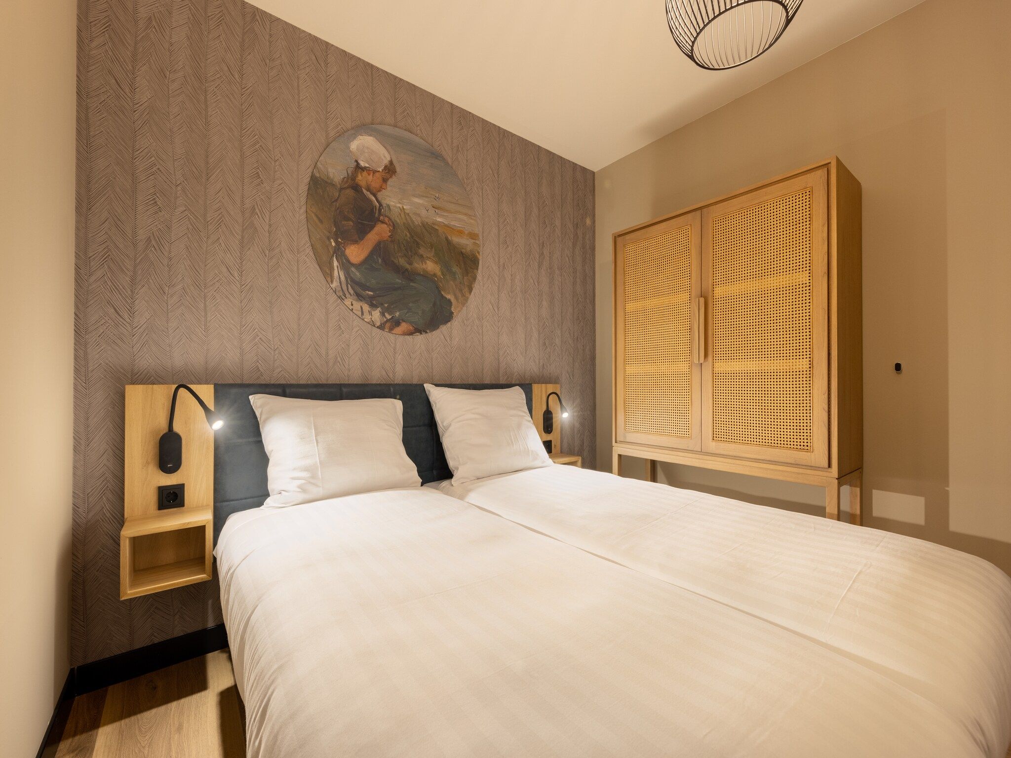 Een slaapkamer van Residentie de Graaf van Egmont 12 in Egmond aan zee