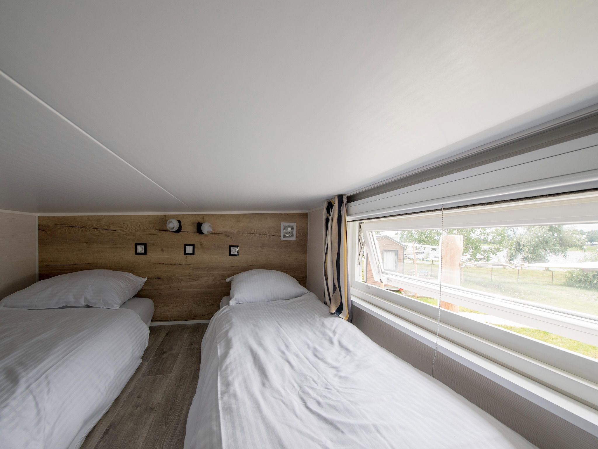 Een slaapkamer van Vakantiepark Eiland van Maurik 9 in Maurik