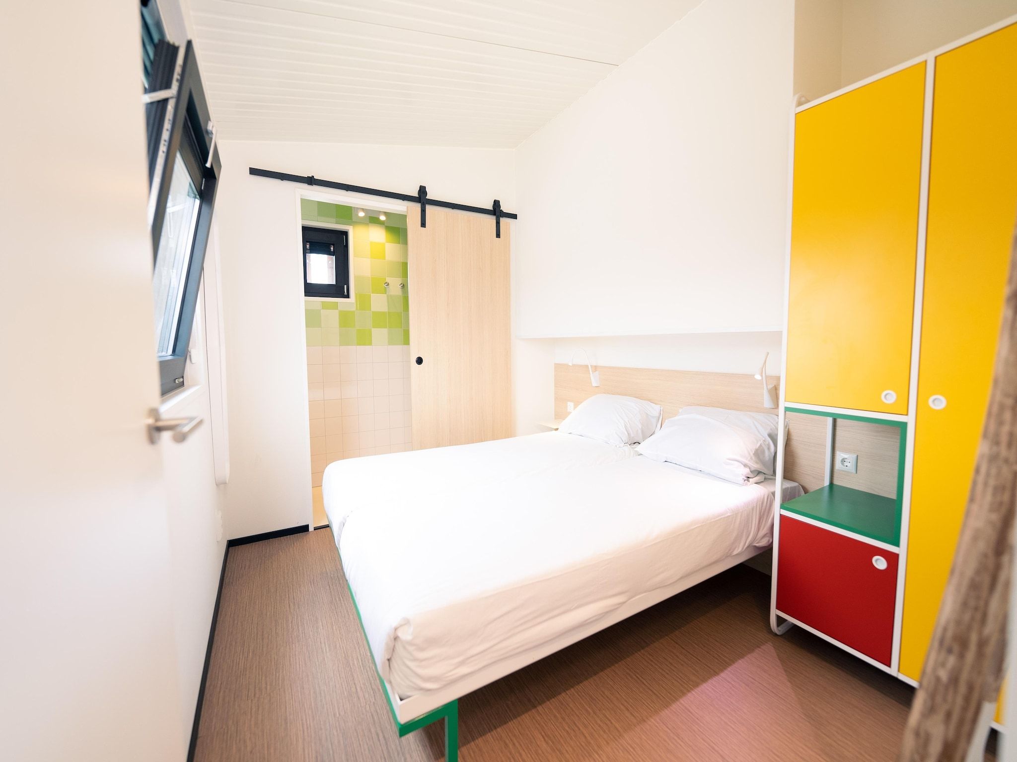 Een slaapkamer van Resort Callantsoog 4 in Callantsoog