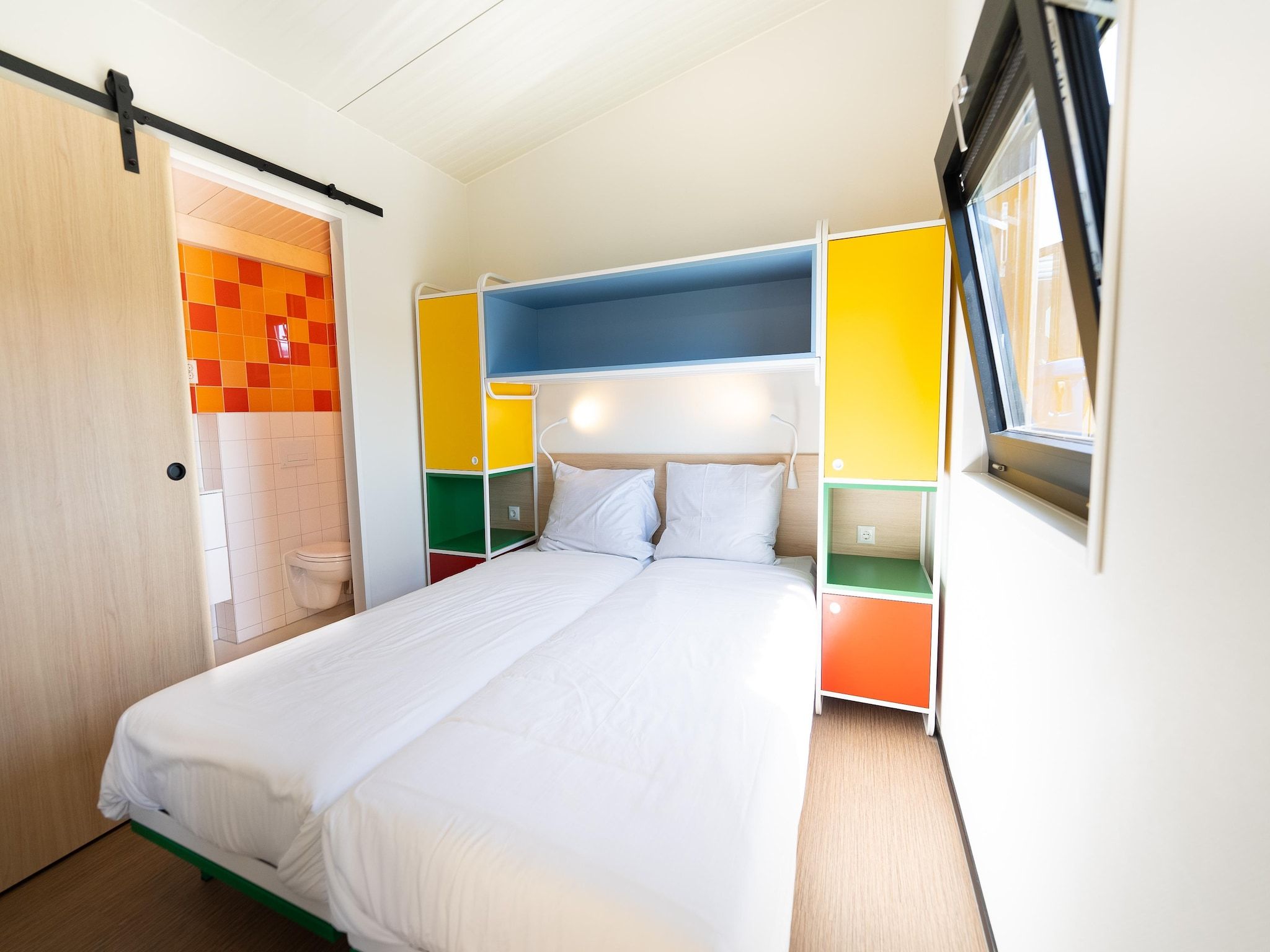 Een slaapkamer van Resort Callantsoog 5 in Callantsoog