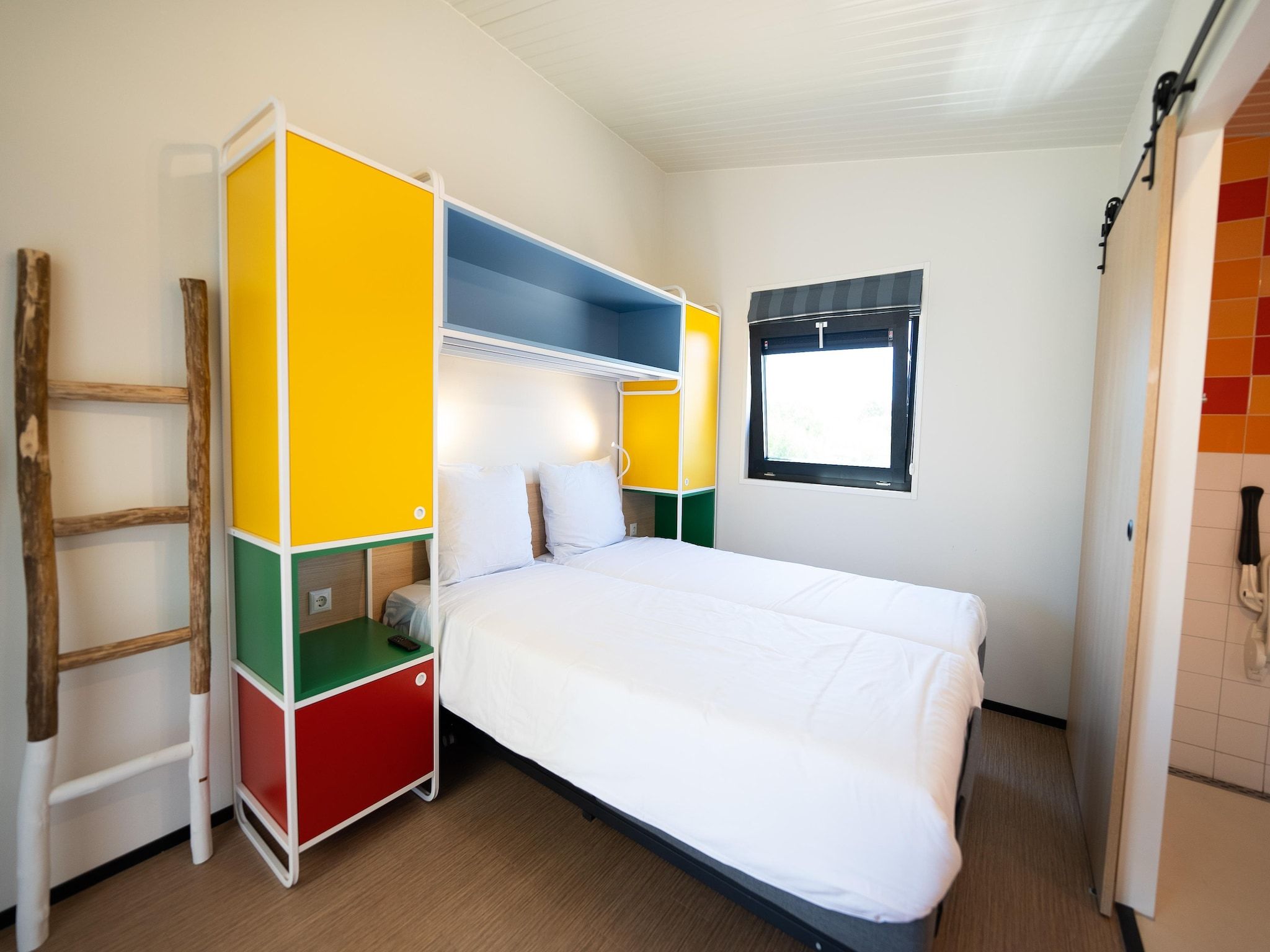 Een slaapkamer van Resort Callantsoog 5 in Callantsoog