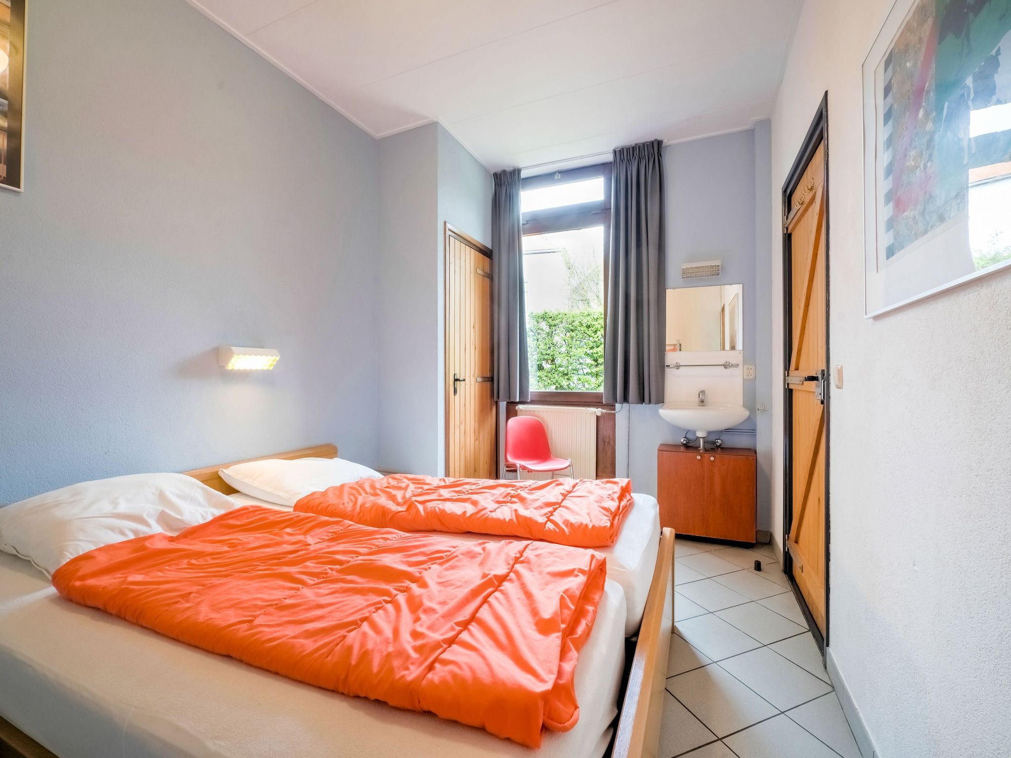 Een slaapkamer van Vliek 14P in Ulestraten